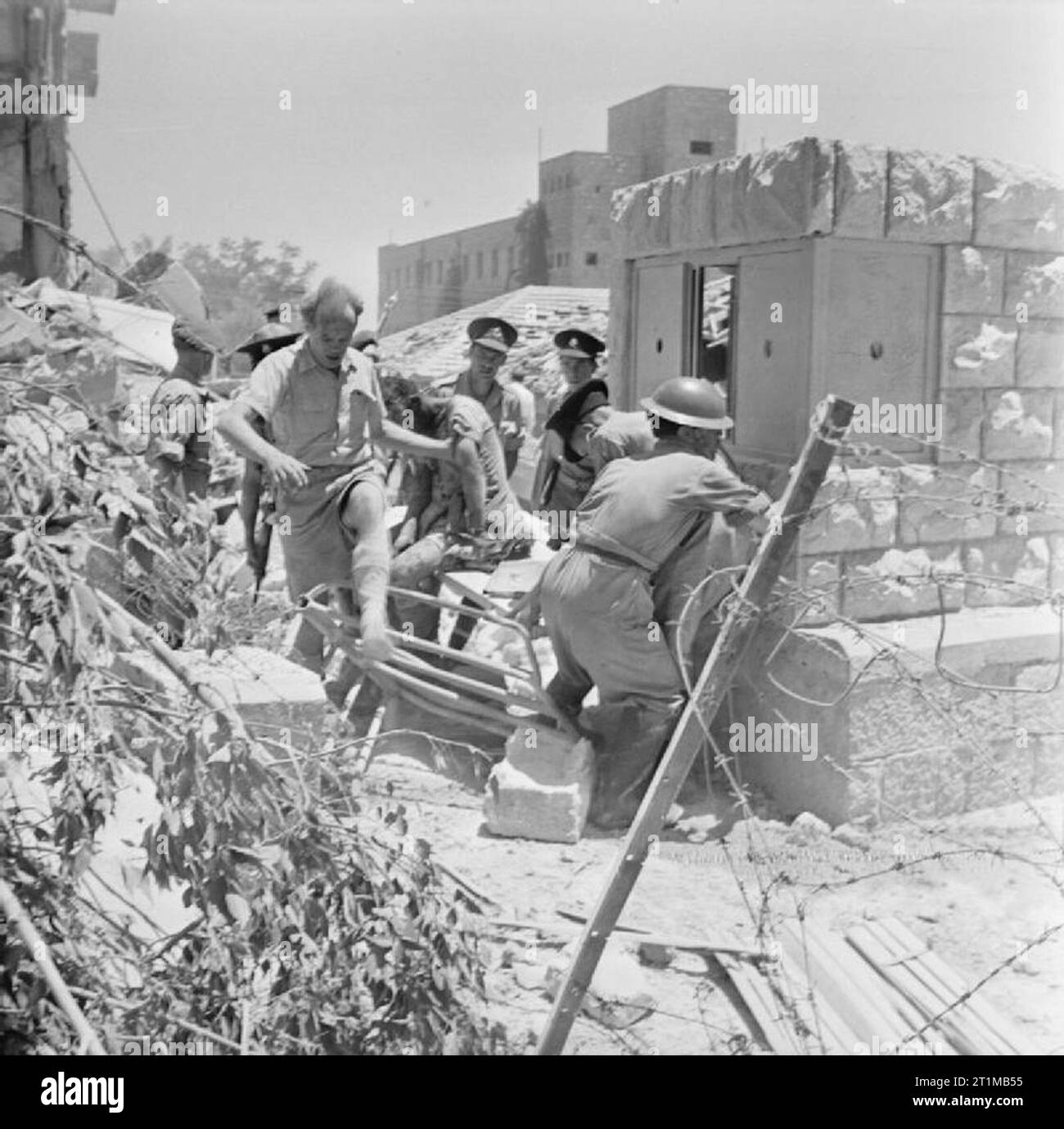 British Forces in the Middle East, 1945-1947 Following the explosions at the King David Hotel in Jerusalem soldiers and members of the Palestine Police work to rescue victims from the wreckage. The hotel housed the Military headquarters for all armed forces in Palestine as well as the offices of the Palestine Government. The attack on the hotel was the biggest blow struck against British rule in Palestine by fighters of the Jewish 'Irgun' organisation. Stock Photo