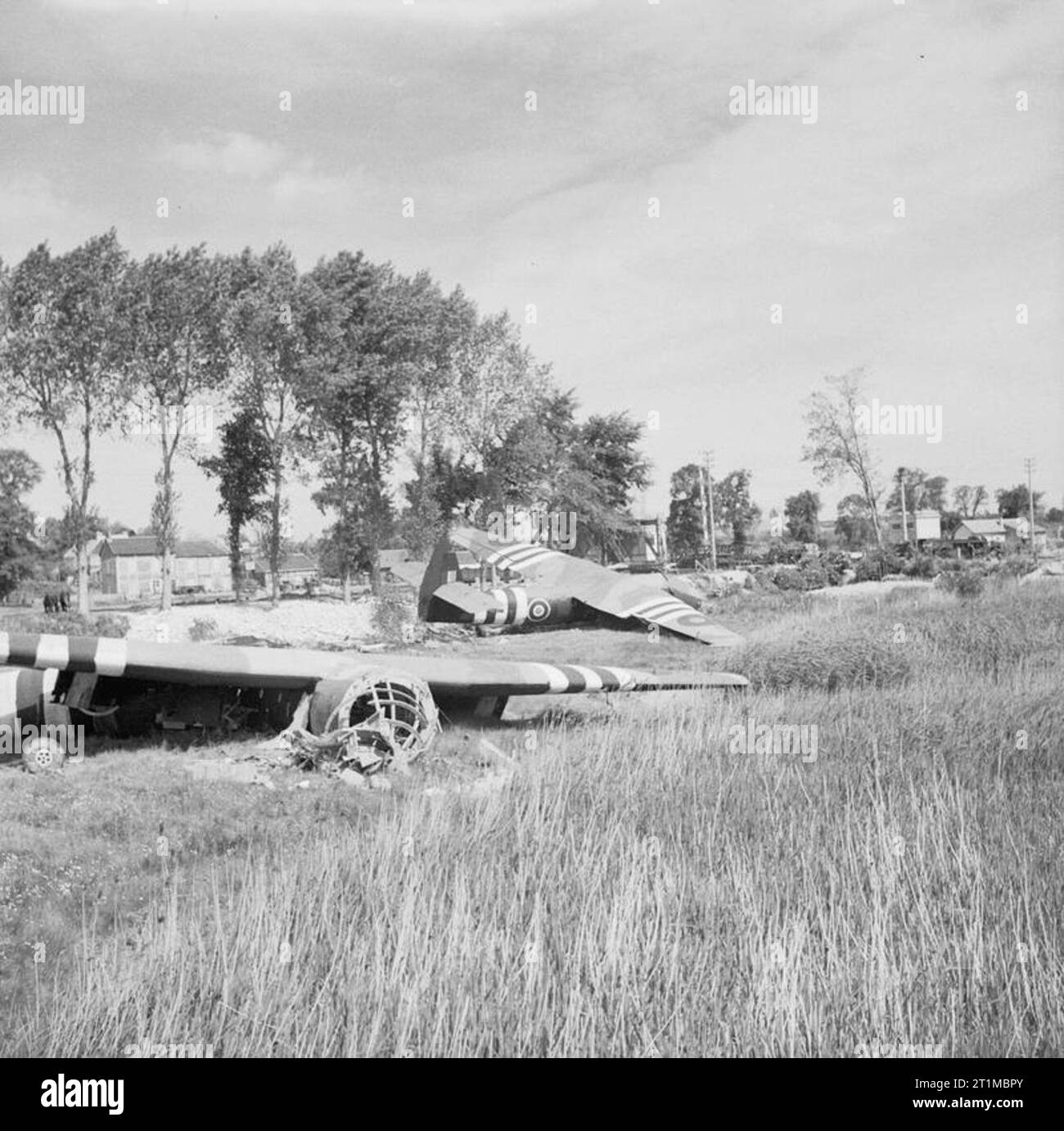 The British Army in the Normandy Campaign 1944 Horsa gliders near the Caen Canal bridge at Benouville, 8 June 1944, part of 6th Airborne Division's 'coup de main' force, carrying men of 'D' and 'B' Company, 2nd Battalion Oxfordshire and Buckinghamshire Light Infantry, which captured the bridges over the Orne River and Caen Canal in the early hours of D-Day. In the foreground is glider No. 93, which carried Lieutenant David Wood's platoon, with behind, glider No. 91, which carried the force commander, Major John Howard, and Lieutenant Den Brotheridge's platoon. Stock Photo