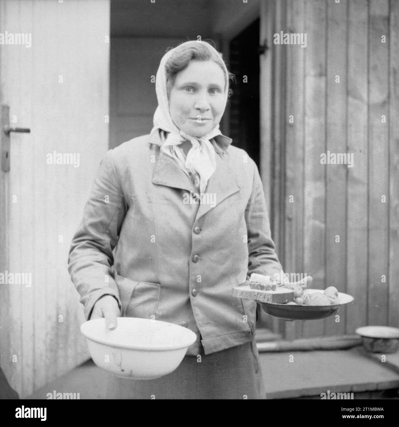 Woman carrying soup Black and White Stock Photos & Images - Alamy