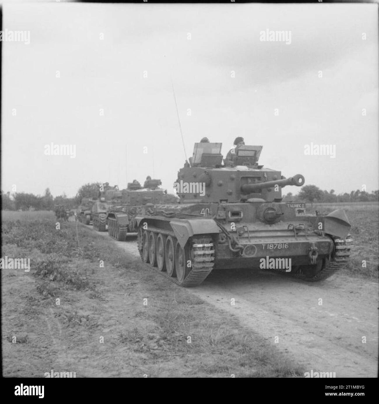 The British Army in the Normandy Campaign 1944 A Cromwell command tank, named 'Taureg II', of 11th Armoured Division HQ leads a Centaur OP tank with dummy gun and two Shermans during Operation 'Epsom', 26 June 1944. Stock Photo