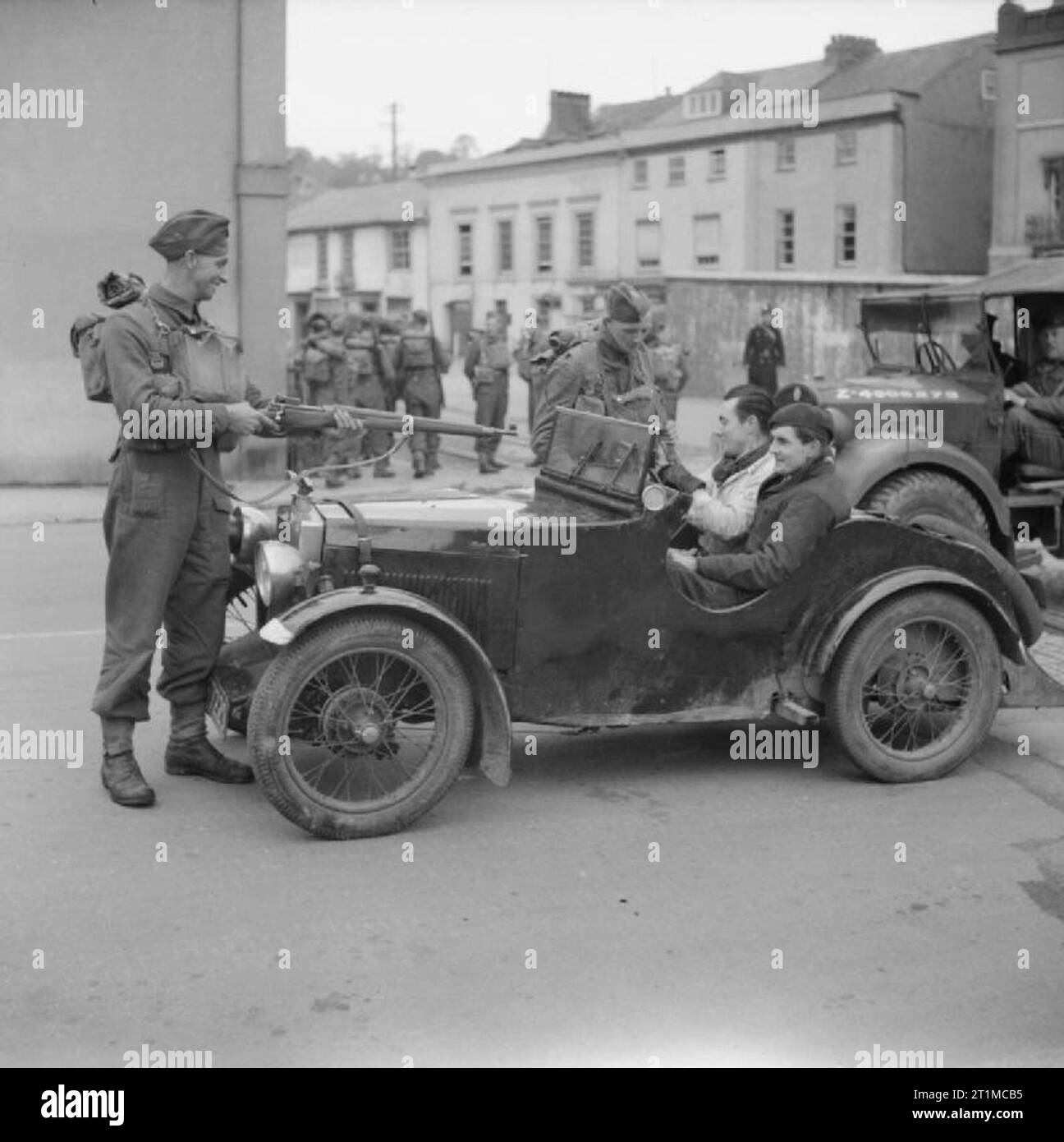 The British Army in the United Kingdom 1939-45 Troops in a town stop a ...