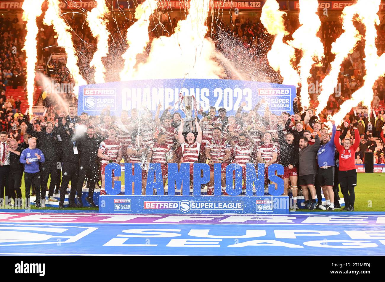 Liam Farrell #12 of Wigan Warriors lifts the trophy following the ...