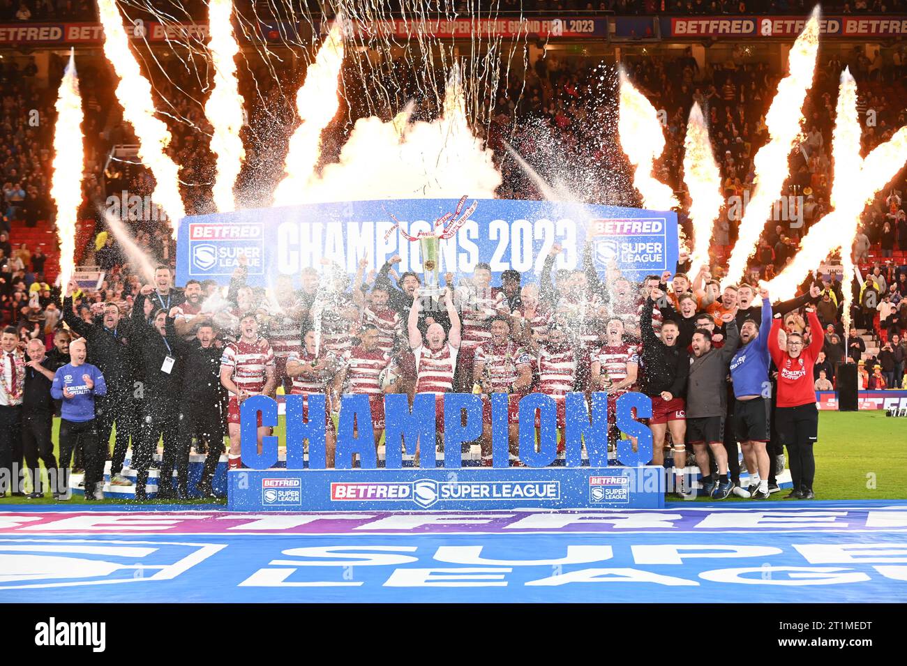 Liam Farrell #12 of Wigan Warriors lifts the trophy following the ...