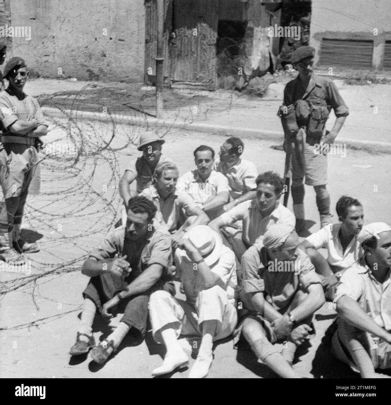 The British Mandate in Palestine 1917-1948 British paratroops guard Jewish suspects rounded up in Haifa during one of the cordon-and-sweep operations designed to root out guerrillas. Stock Photo