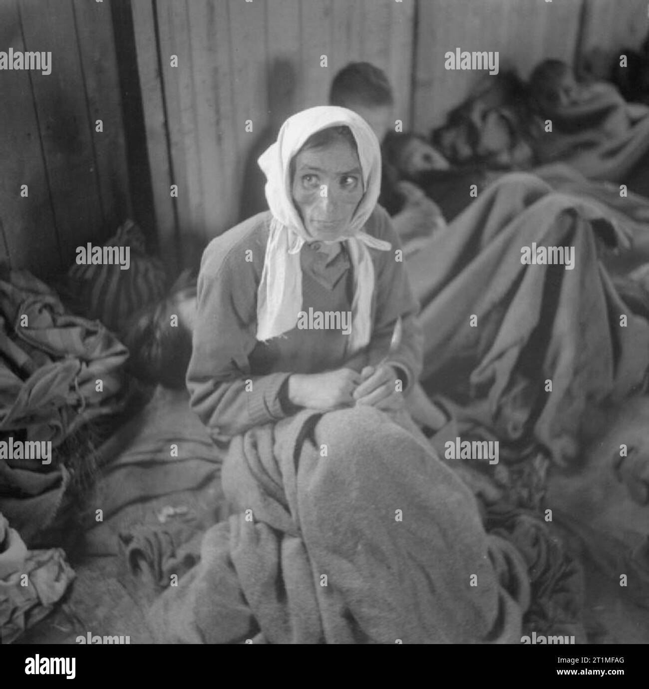 The Liberation of Bergen-belsen Concentration Camp, April 1945 A woman inmate suffering from typhus in one of the camp huts. Stock Photo