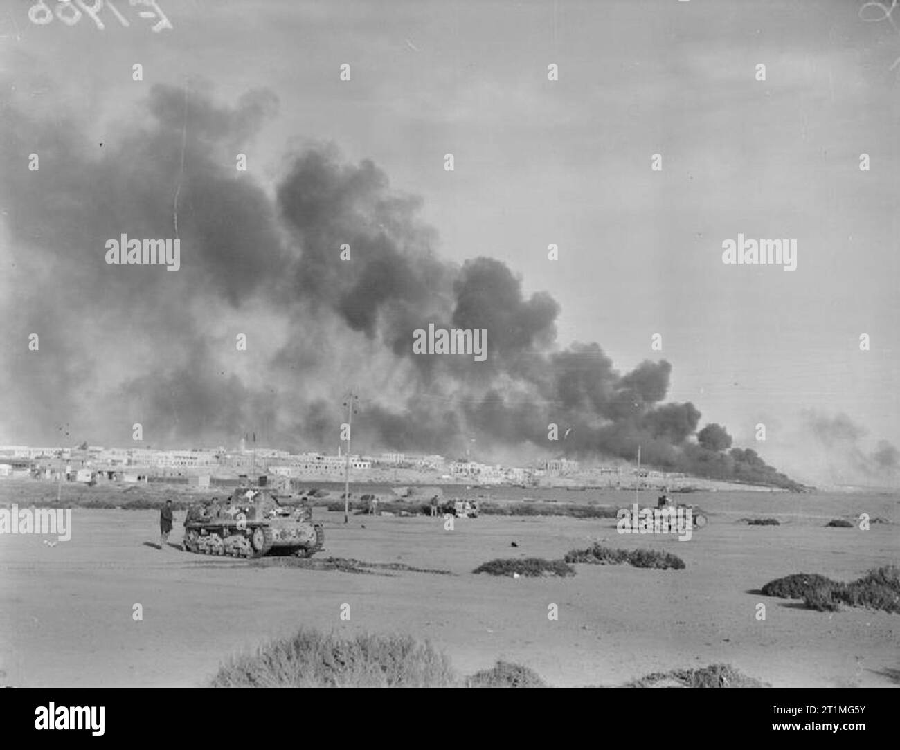 The Western Desert Campaign, 1941 Port installations burn over the