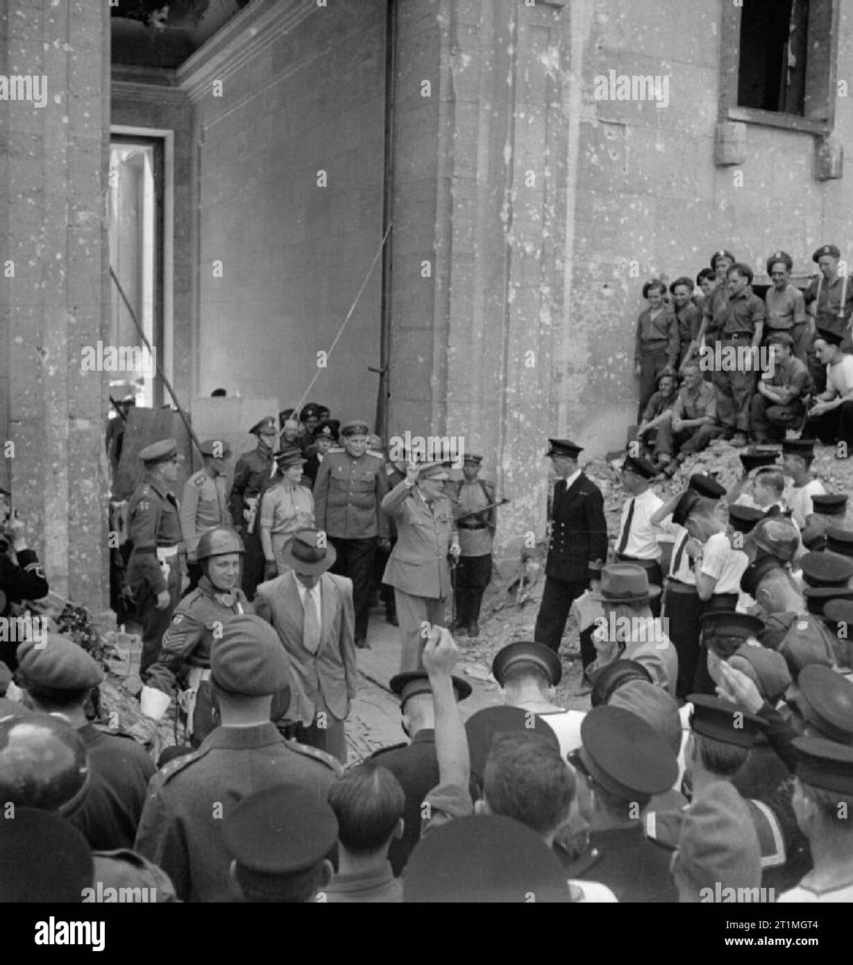 Winston Churchill in Berlin, July 1945 Prime Minister Winston Churchill leaves the ruins of Adolf Hitler's Chancellery in Berlin, Germany, on 16 July 1945. Stock Photo