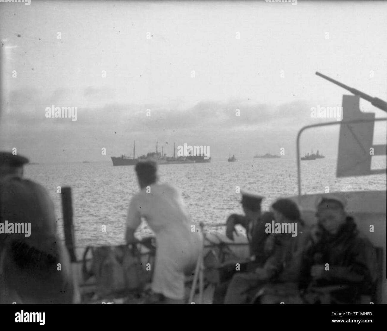 Operation Pedestal, August 1942 15 August: The arrival of the OHIO at Malta: The destroyer LEDBURY alongside the damaged tanker OHIO. OHIO's structure had been so weakened by repeated attacks that she was incapable of steaming on her own and needed a destroyer on either side to support her. Stock Photo