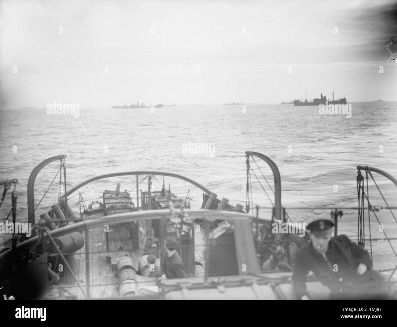 The Battle of the Atlantic 1939-1945 Convoys: Merchant ships in convoy seen from the after deck of a tug. Stock Photo