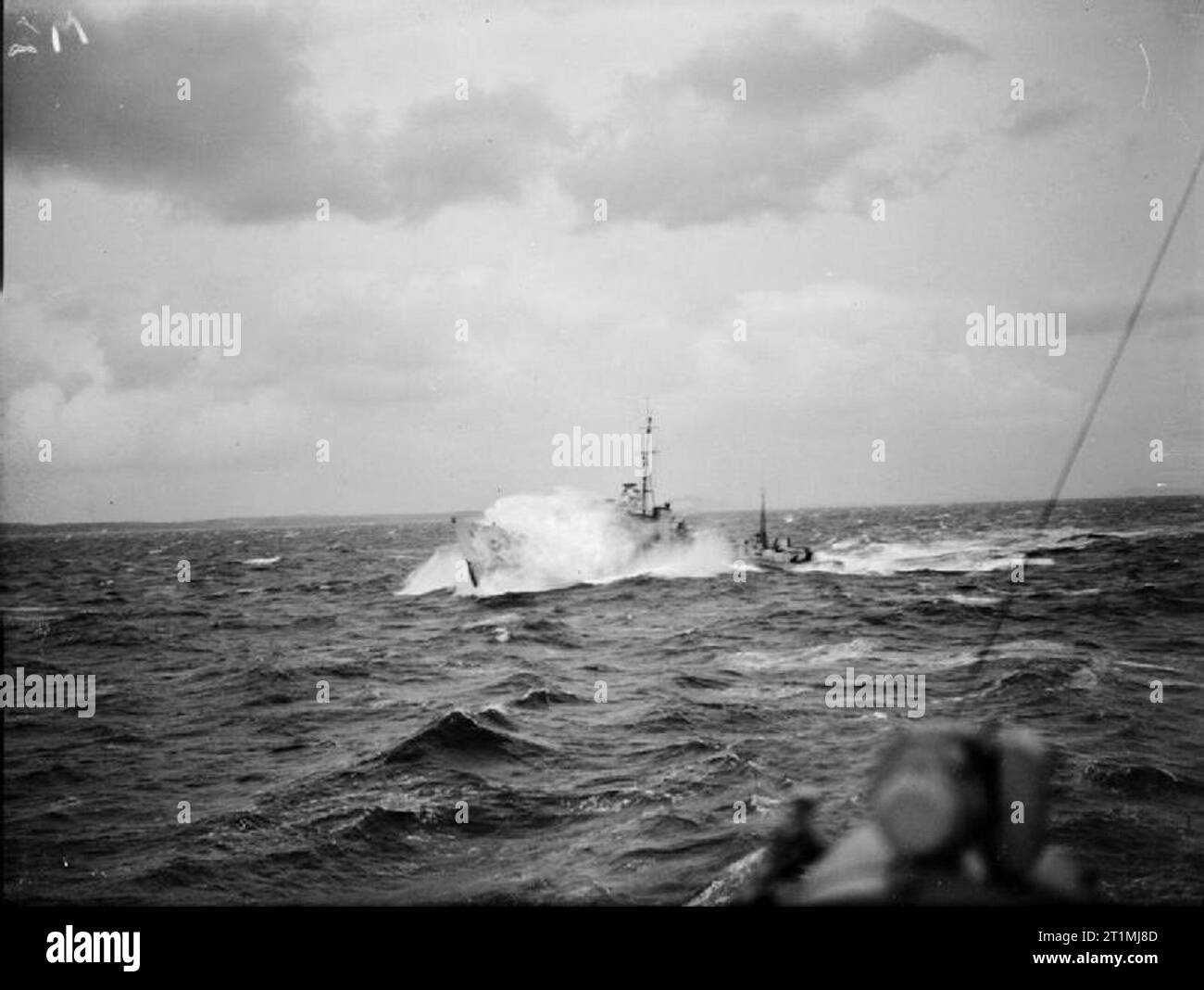 The Battle of the Atlantic 1939-1945 Convoys: A destroyer escort steaming through heavy seas while escorting a convoy. Stock Photo