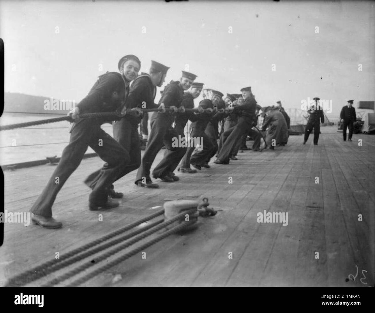 The Royal Navy during the Second World War Sailors haul away on one of