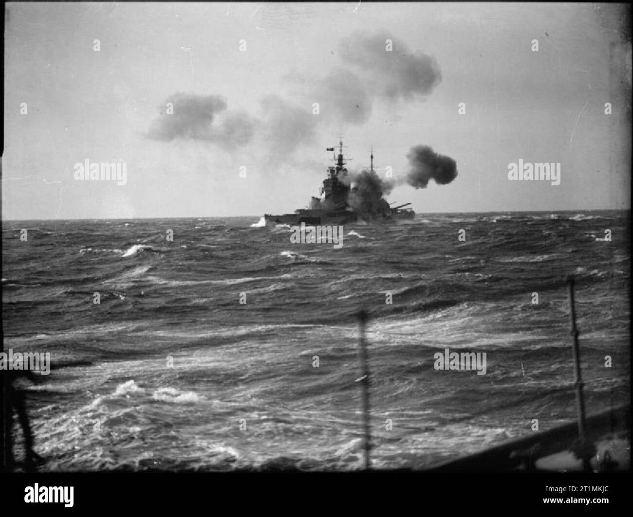 The Royal Navy during the Second World War HMS HOWE firing a broadside ...