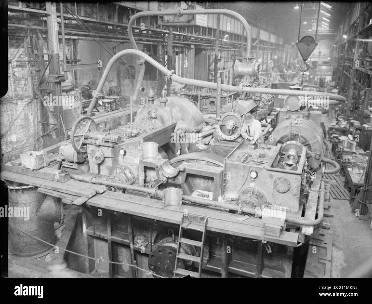 The Royal Navy during the Second World War General view of an engine prior to been fitted to a ship, the main feature of these ships is the pre-fabricated parts. They are being constructed at the Newcastle and District, Furness and Co, Shipyard Billingham. Stock Photo