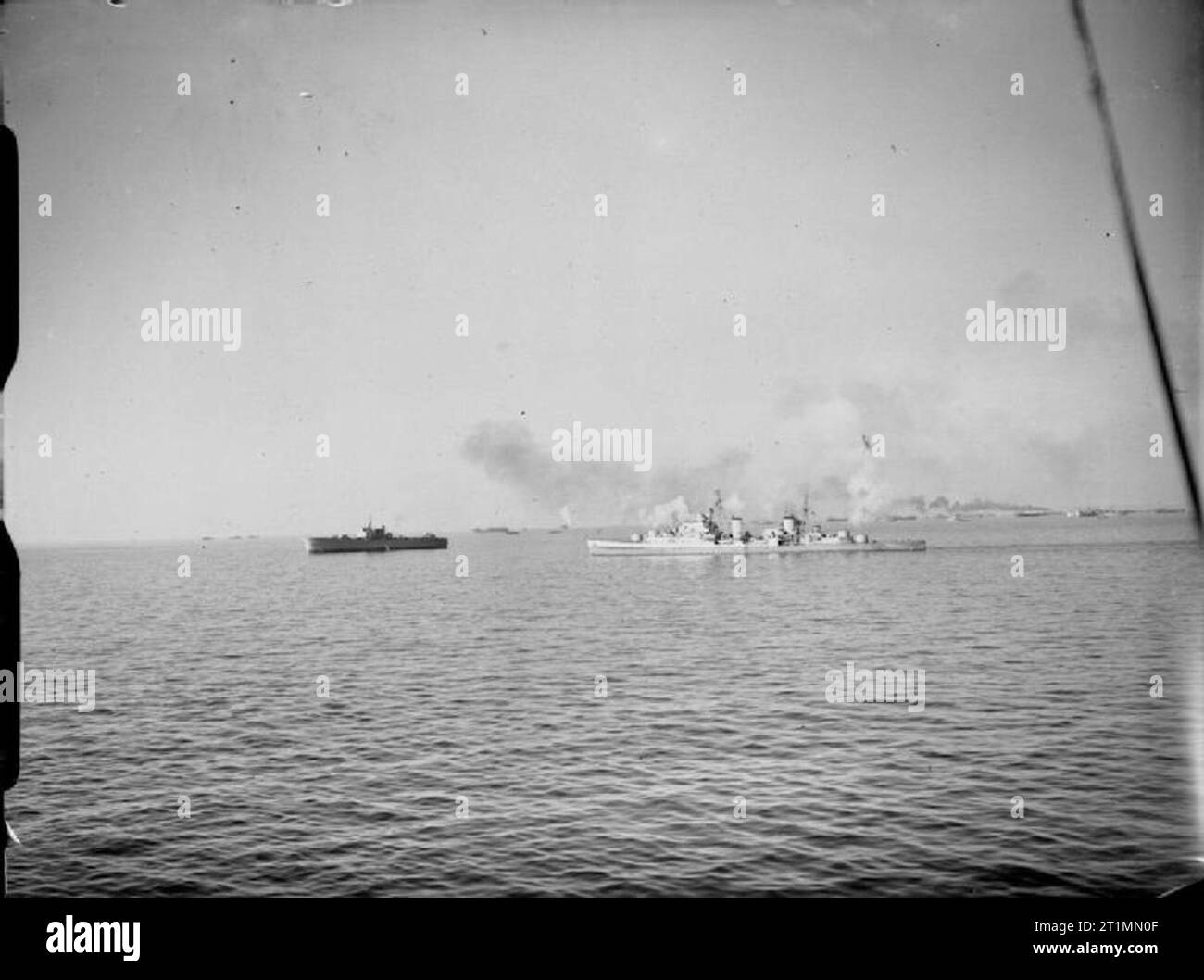 The Royal Navy during the Second World War General view from on board the cruiser ORION of the invasion craft of the Fifth Army waiting their turn to proceed to the beaches at Anzio in the opening stages in the battle for Rome. HMS SPARTAN can be seen in the middle distance assisting with the bombardment. Stock Photo