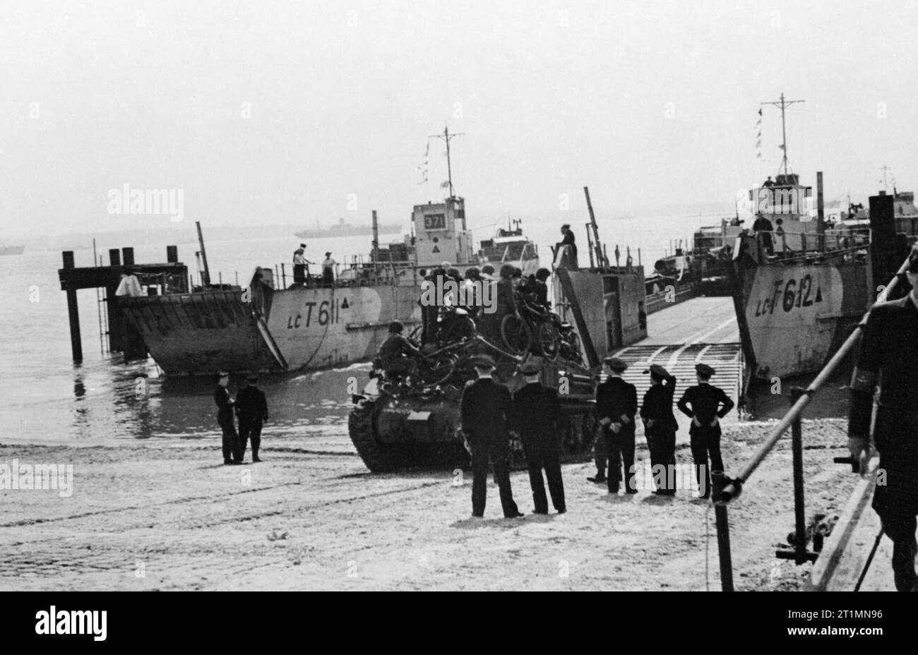 The Royal Navy during the Second World War Sherman tank embarking backwards in to an LCT at the Hard, Portsmouth during exercises for the Normandy landings. Stock Photo