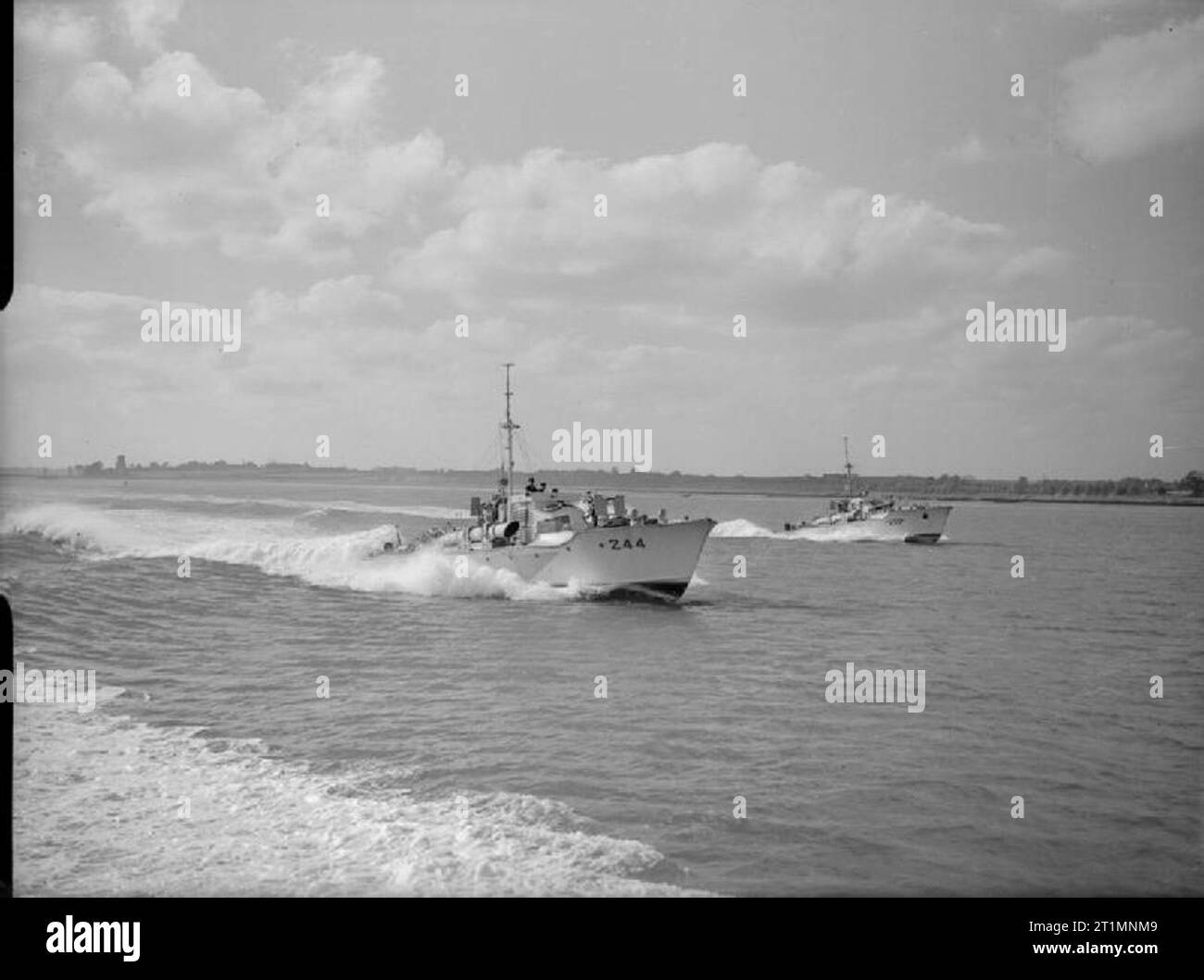 The Royal Navy during the Second World War Vosper MTBs including MTB 224 and MTB 244 of the 21st Flotilla at speed in the River Orwell, off Shotley. The Flotilla was based at Felixstowe and commanded by Lieutenant George J Macdonald DSO, DSC and two bars, RNZNVR of Wellington, New Zealand. Photograph taken shortly before the Flotilla's remaining 71ft Vospers were paid off and replaced by the new 73ft Vosper in 1943. Stock Photo