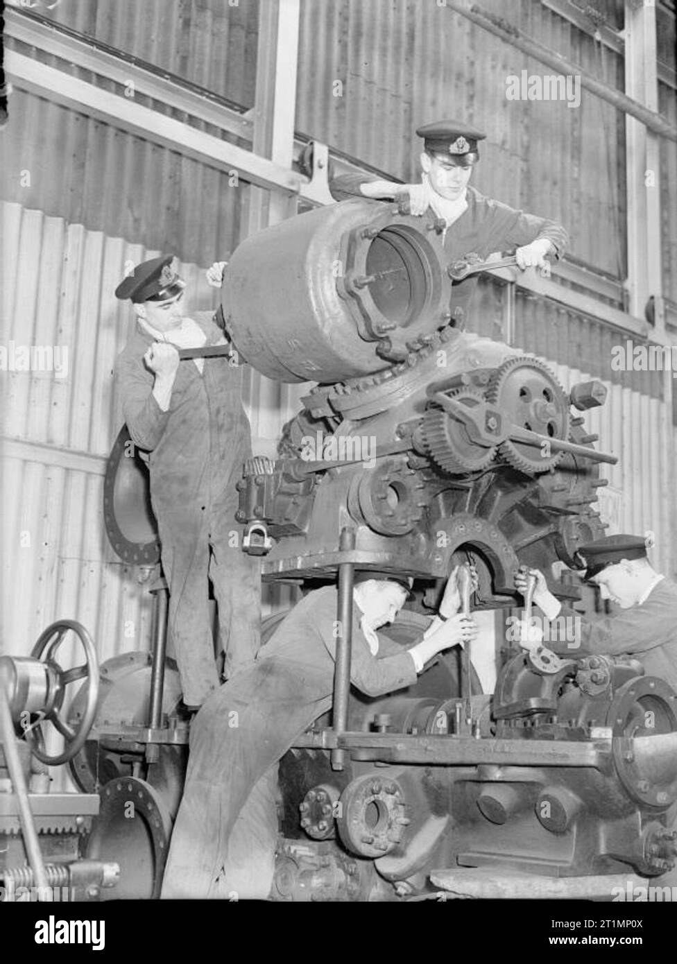 The Royal Navy during the Second World War Royal Navy engineers must be capable of tackling the heaviest types of job before leaving the college. Here are some at work on a marine steam turbine out of a destroyer at the Royal Naval Engineering College, Keyham, Devonport. Here officers are trained for the engineering branch of the Royal Navy. Stock Photo