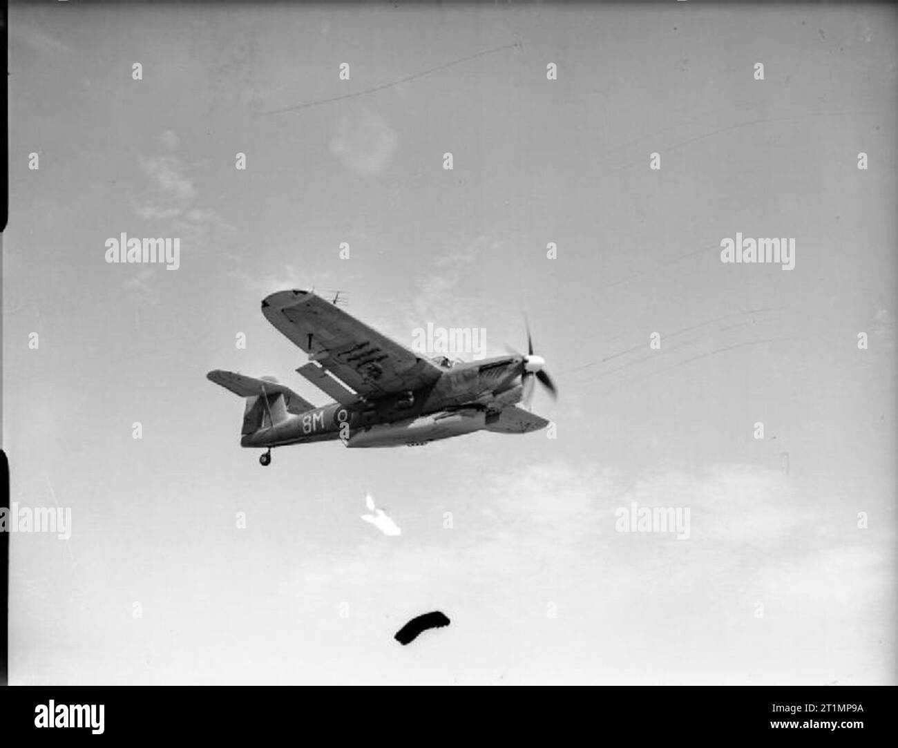 The Royal Navy during the Second World War A Fairey Barracuda Mk III carrying the lifeboat before the demonstration drop of the navy's airborne lifeboat off Lee-on-Solent. The lifeboat, which is 17 ft, 9 ins long, was dropped by parachute to an air crew who were supposed to have forced landed into the sea. The lifeboat, self-righting, and self-baling is equipped with sails and an outboard engine which gives it a range of 120 miles at 4 knots. It contains special water purifying units, first aid outfits, rations and cigarettes. Stock Photo