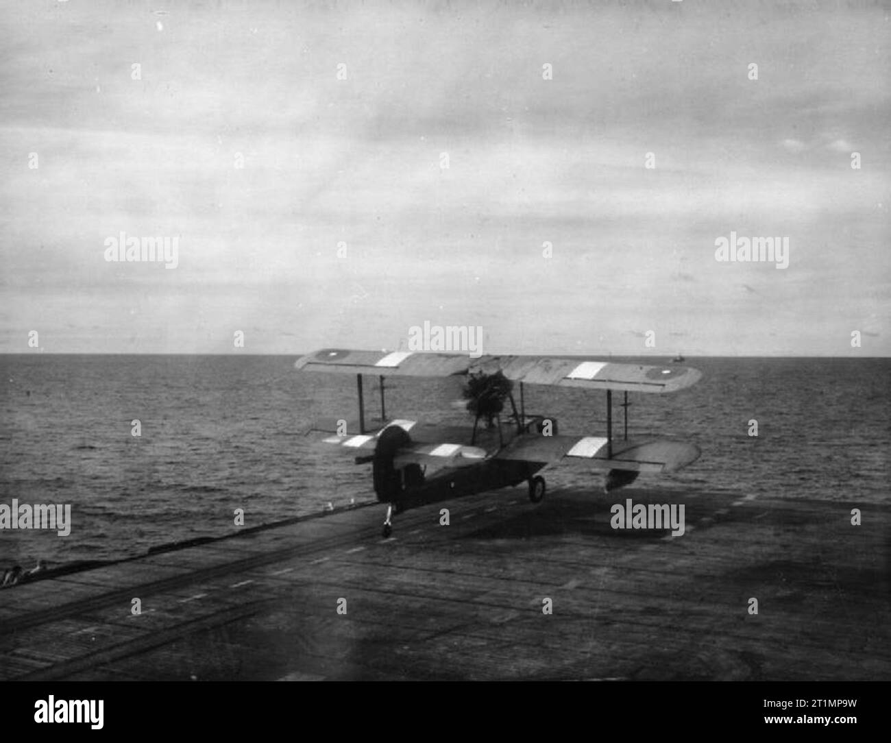 The Royal Navy during the Second World War A Supermarine Walrus amphibious aircraft takes off from HMS KHEDIVE in the Far East to rescue the crew of a ditched bomber spotted in their dinghy 30 miles away. The white patches on the wings of the aircraft are recognition panels designed to prevent friendly fire incidents. Stock Photo