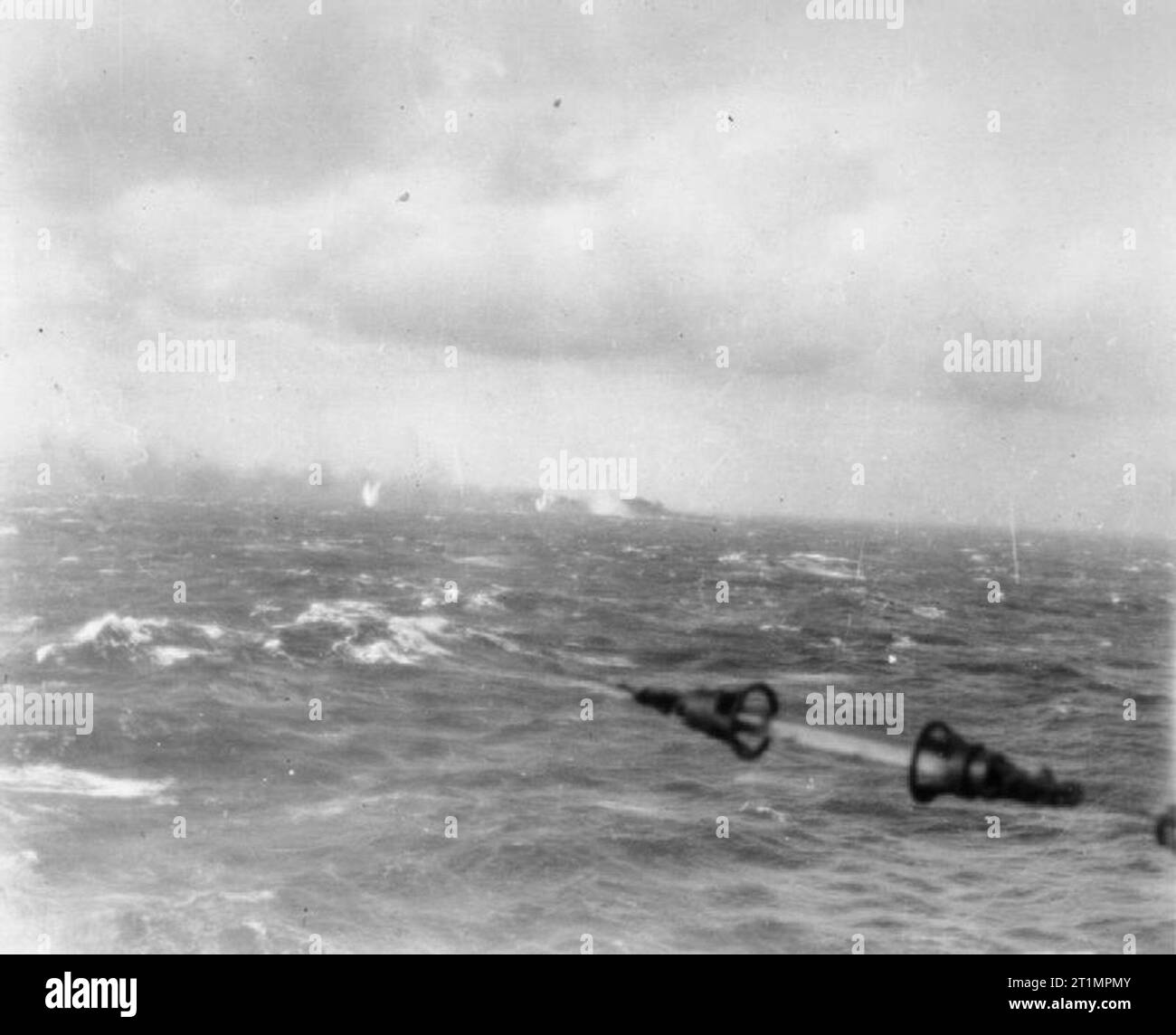 The Royal Navy during the Second World War The sinking of the German battleship BISMARCK: photograph of the BISMARCK on fire in the distance taken from one of the Royal Navy warships chasing. Stock Photo