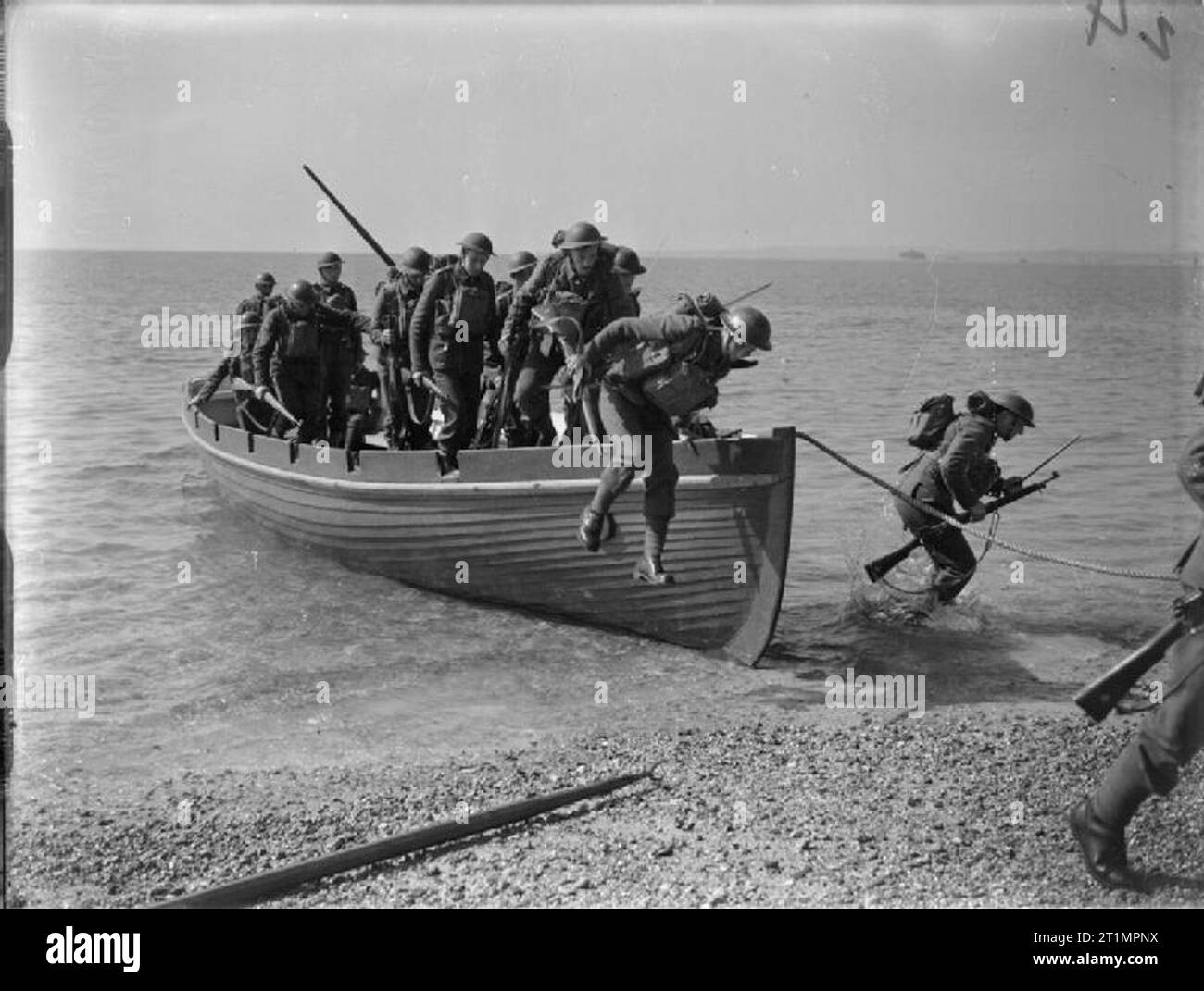 The Royal Navy During The Second World War A Royal Marines Landing Party Jumping Out Of A Cutter