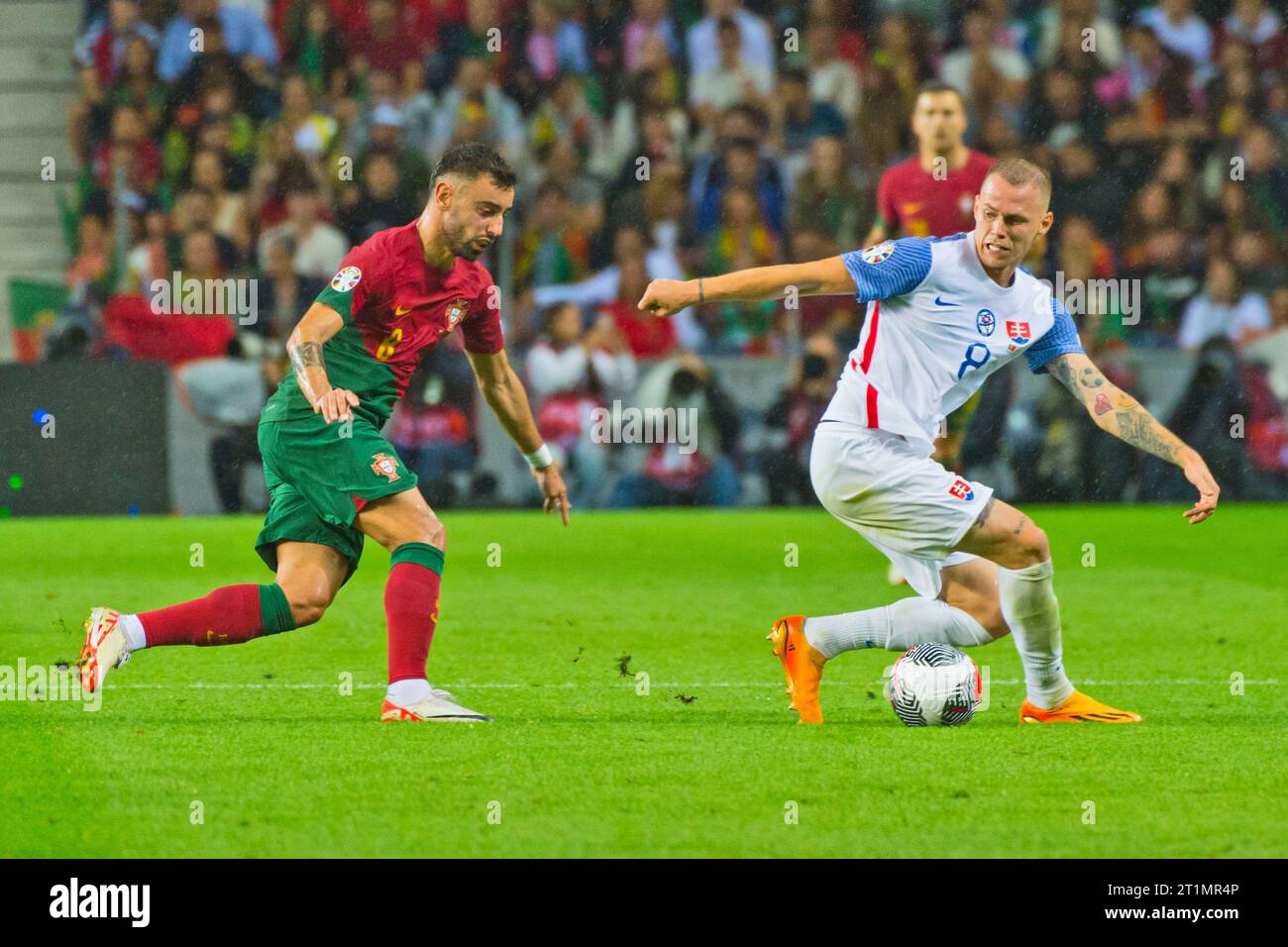 Porto, Portugal. 13th Oct, 2023. Ondrej Duda and Bruno Fernandes disputing the ball during the UEFA Euro 2024, European Qualifiers, Group J, football match between Portugal and Slovakia on October 13, 2023 at Estadio do Dragao in Porto, Portugal - Photo Jose Salgueiro/SIPA USA Credit: Sipa USA/Alamy Live News Stock Photo