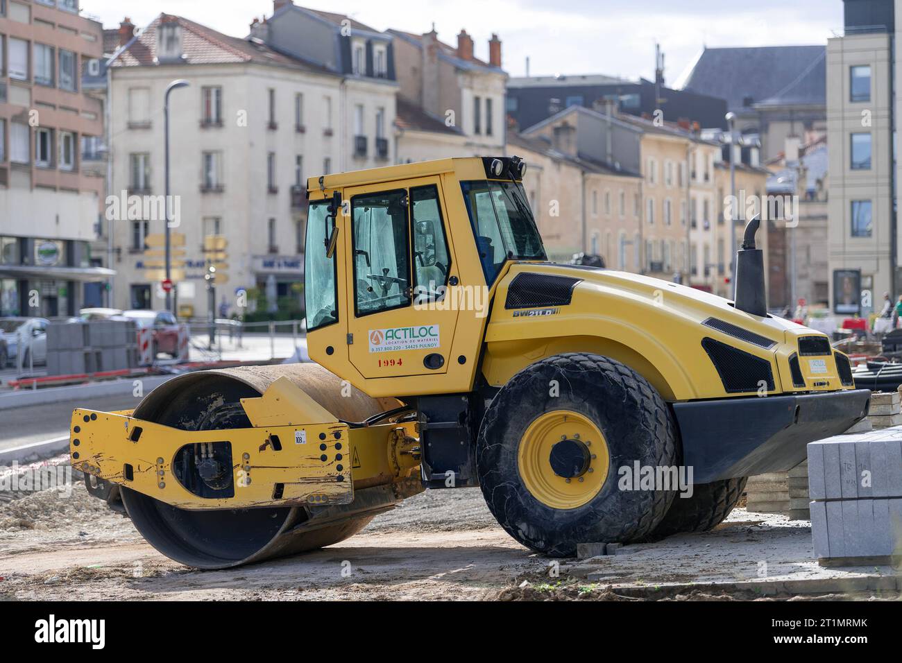 Yellow single drum roller Bomag BW 211 D on construction site Stock