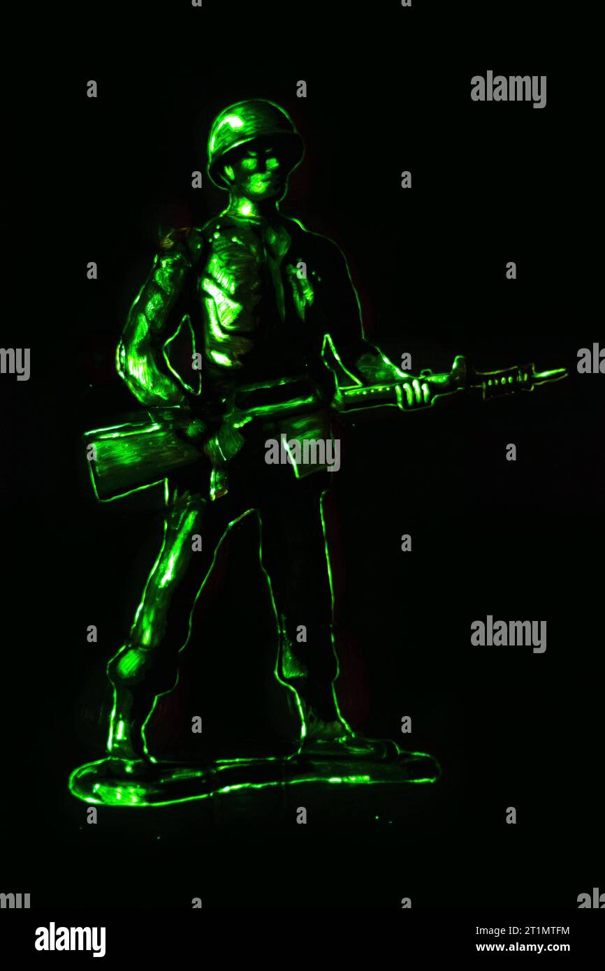 green army man illuminated on black background Stock Photo