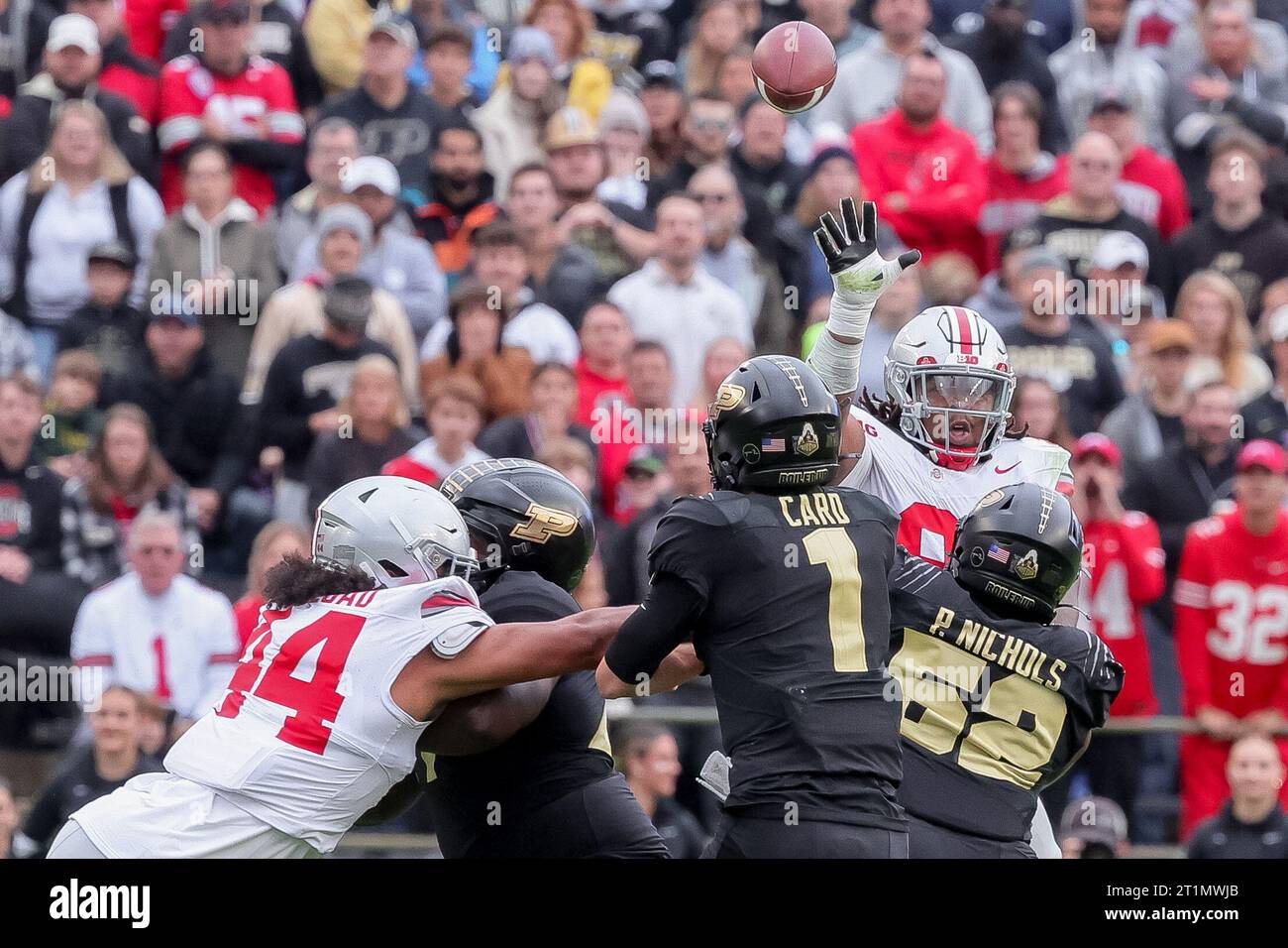 West Lafayette, Indiana, USA. 14th Oct, 2023. Purdue Boilermakers quarterback Hudson Card (1) passes over the outstretched hands of Ohio State Buckeyes defensive tackle Tyleik Williams (91) during the game between the Ohio State Buckeyes and the Purdue Boilermakers at Ross-Ade Stadium, West Lafayette, Indiana. (Credit Image: © Scott Stuart/ZUMA Press Wire) EDITORIAL USAGE ONLY! Not for Commercial USAGE! Stock Photo