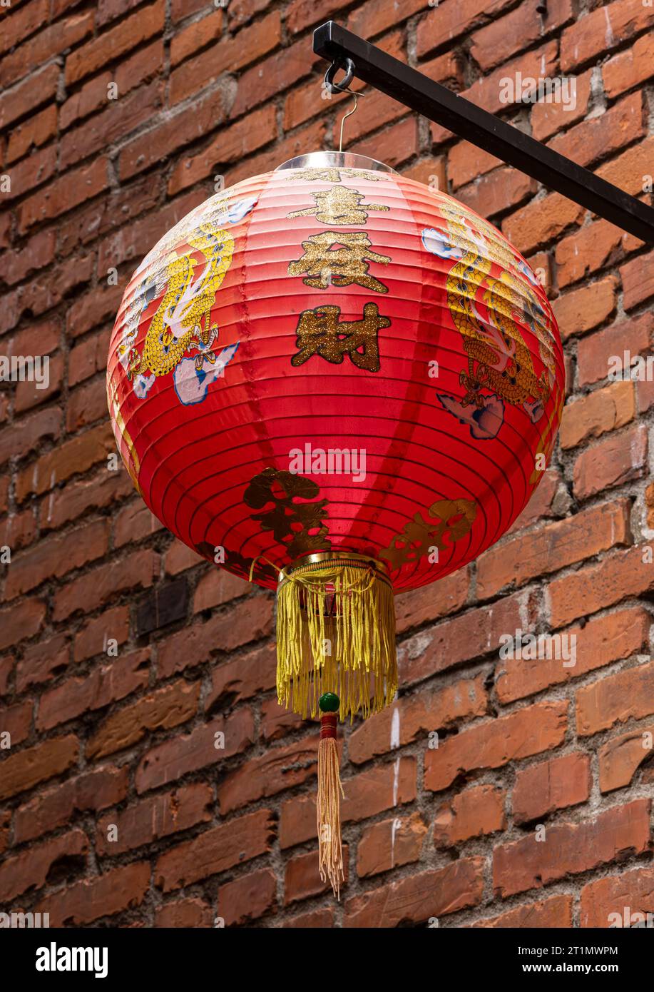 A decorative lantern hanging in Fan Tan Alley in Chinatown, Victoria, British Columbia, Canada. Stock Photo