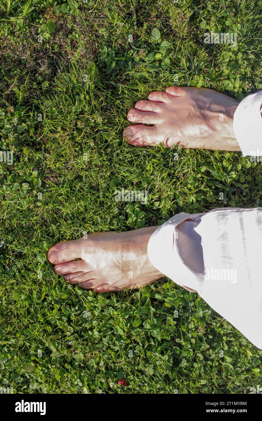 walking barefoot on the grass in my garden Stock Photo
