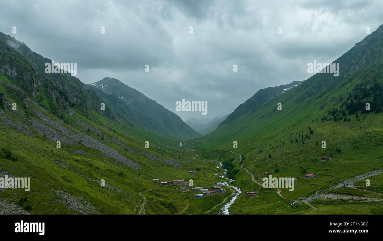 mountain peak and the river flowing through it. Green mountains black ...