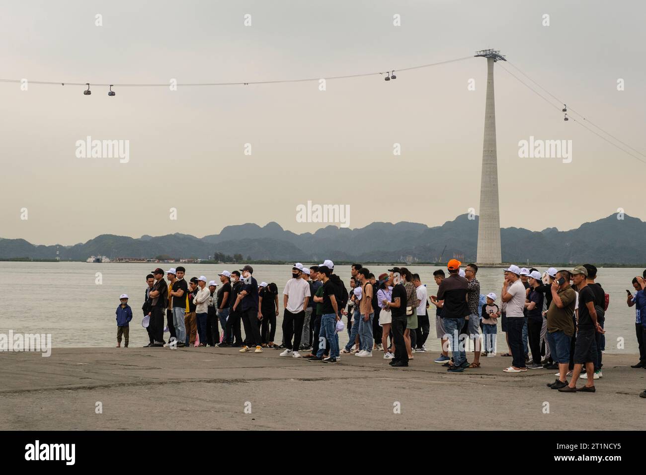 Passengers Waiting to Board Ferry from Haiphong Harbor to Cat Ba Island. Cap Treo Cable Gondola, linking Cat Ba Island to Haiphong, Ha Long Bay, Vietn Stock Photo