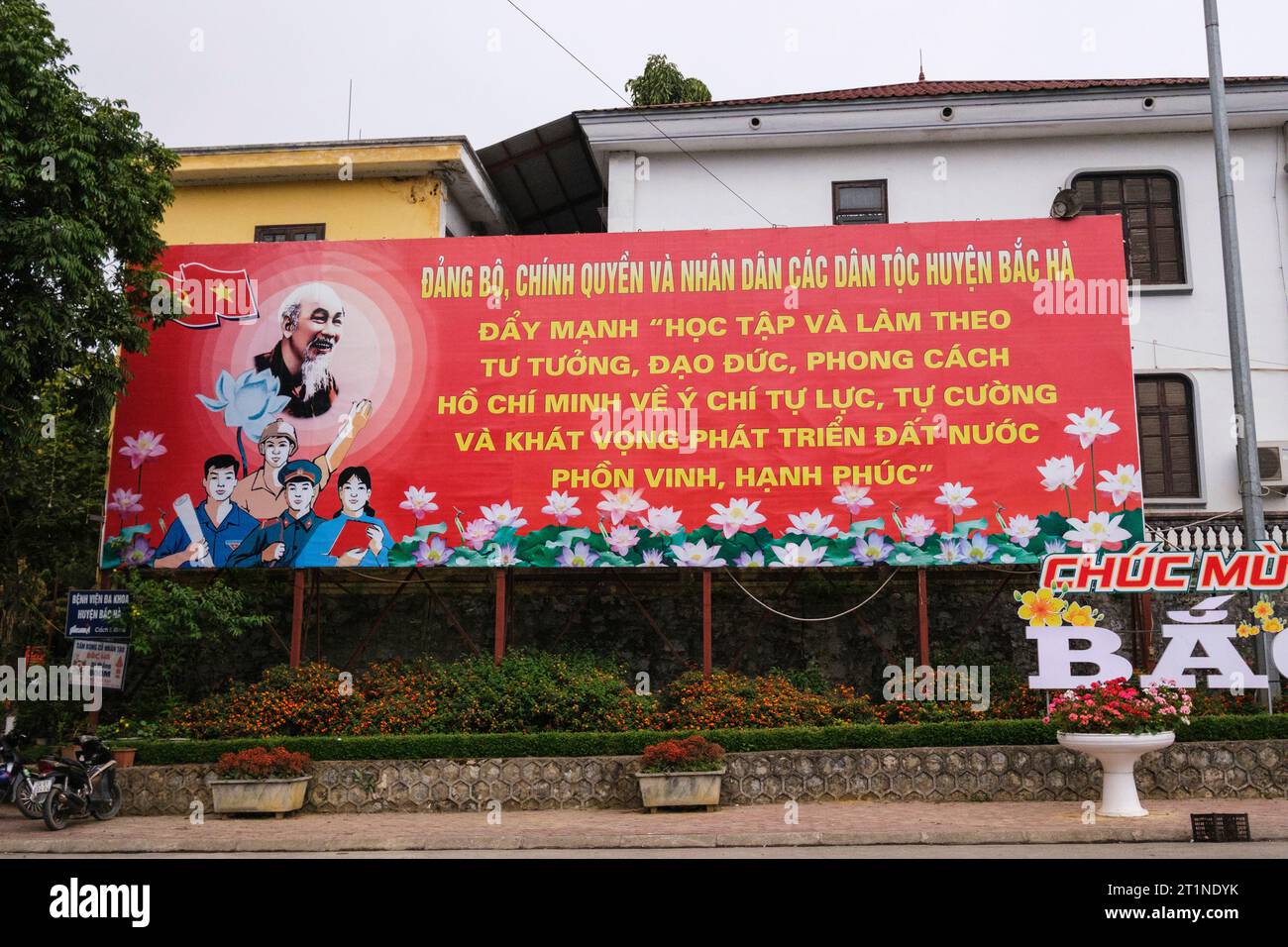 Bac Ha, Vietnam. Political Poster Urging Citizens to Study and Follow Ho Chi Minh's Guidance to Develop a Happy and Prosperous Country. Stock Photo