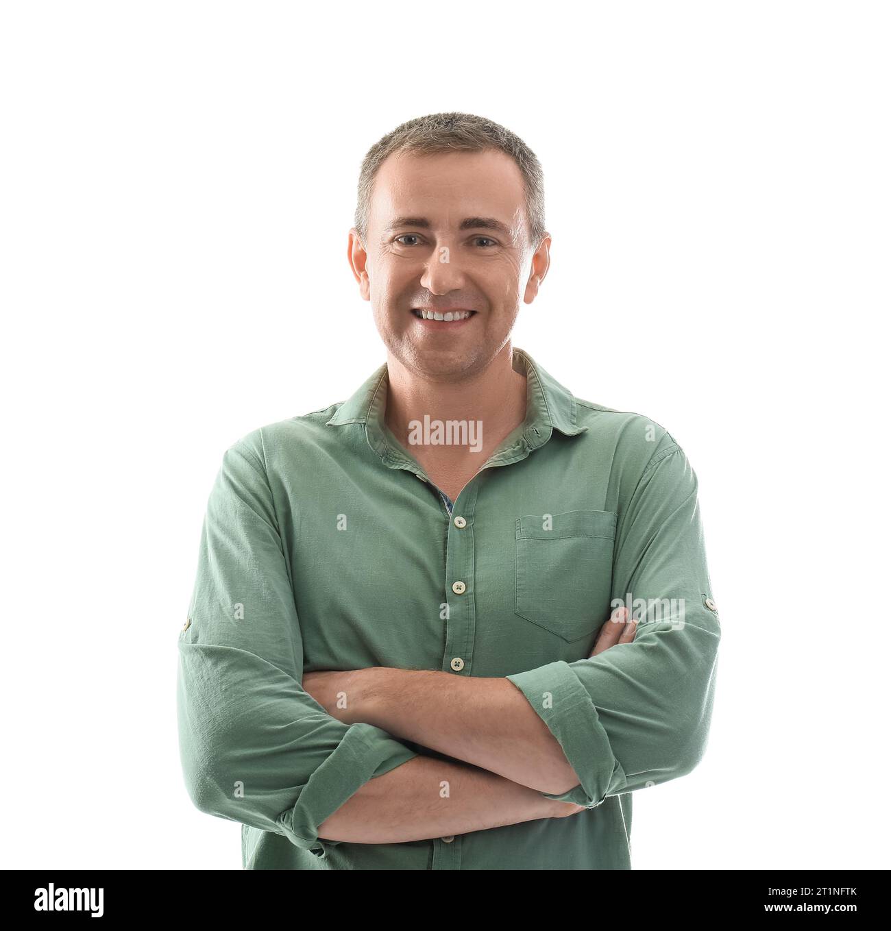 Portrait of happy mature man with crossed arms on white background ...
