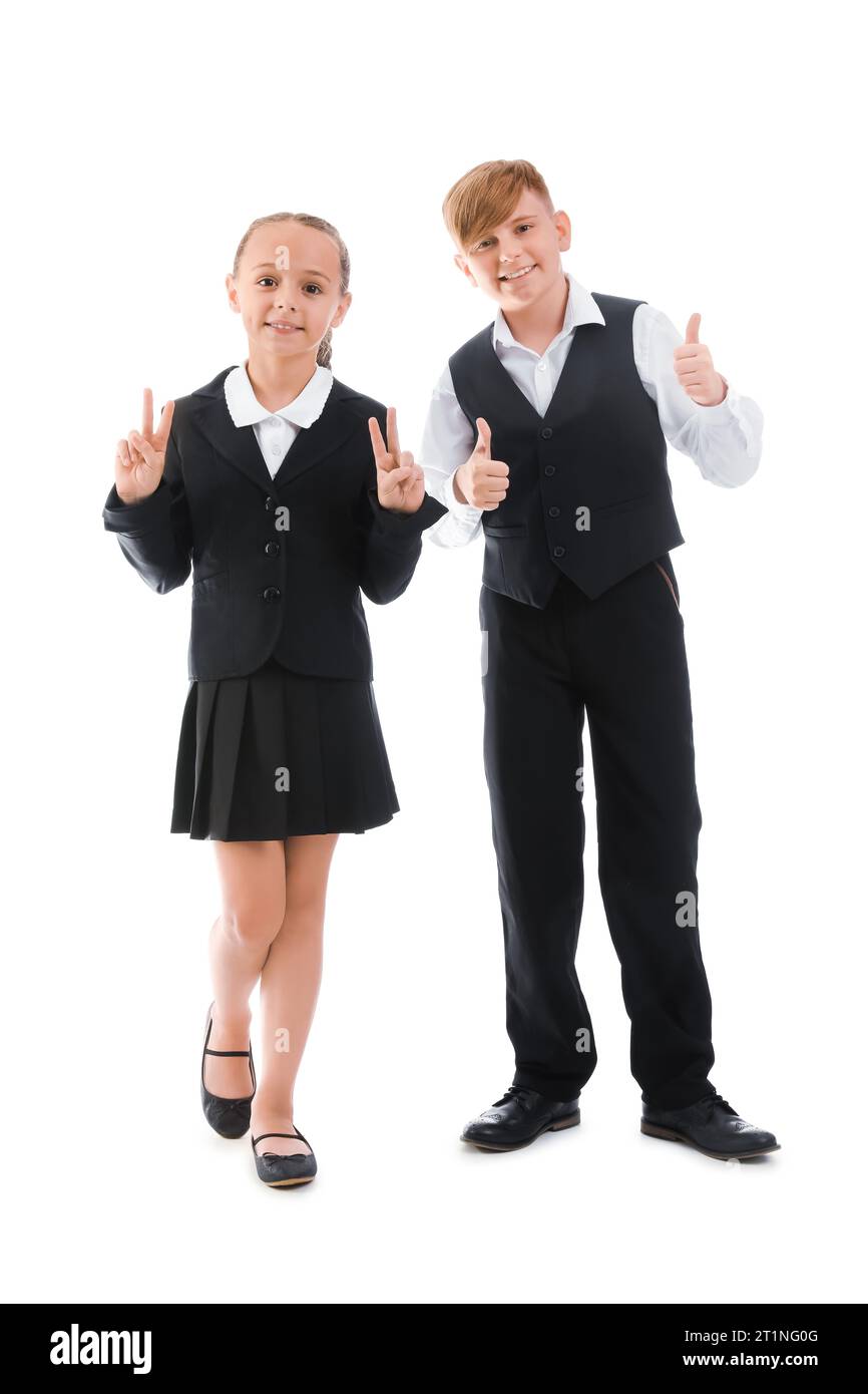 Little classmates in stylish uniform with backpacks showing thumbs-up ...