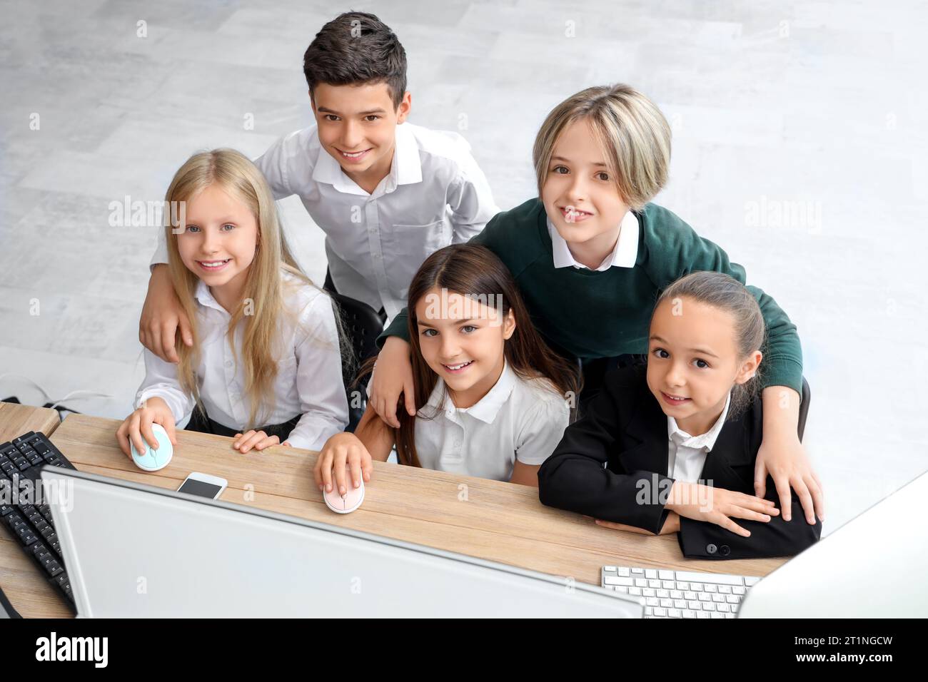 Little children studying at school computer lab Stock Photo - Alamy