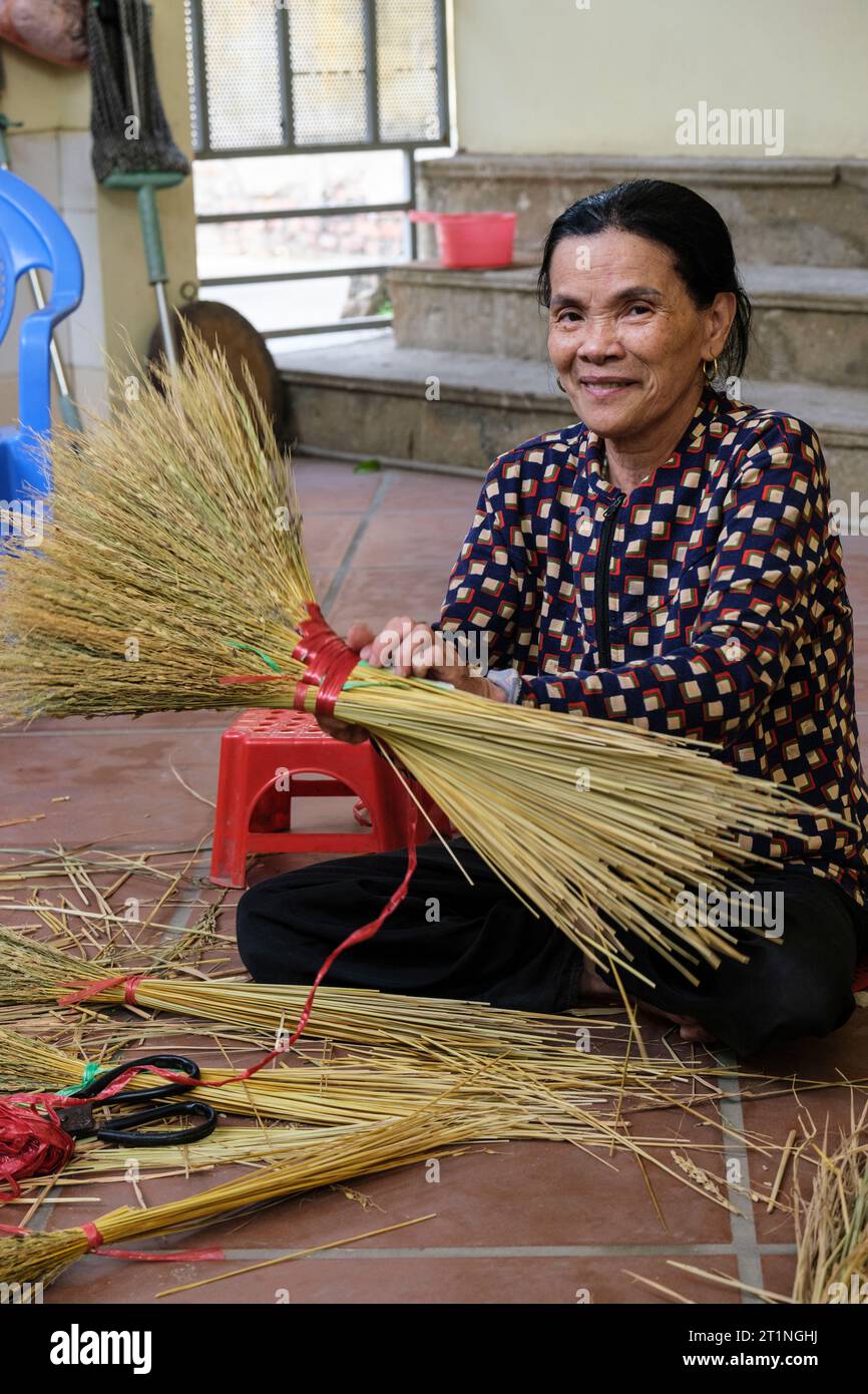 Long Khe, Bac Ninh Province, Vietnam. Woman Making Brooms. Stock Photo