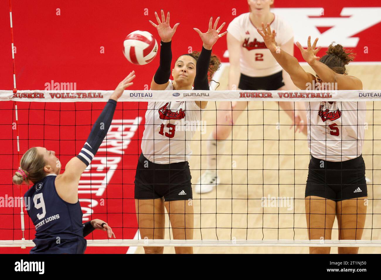 Nebraska's Merritt Beason (13) And Bekka Allick (5) Go Up To Block ...