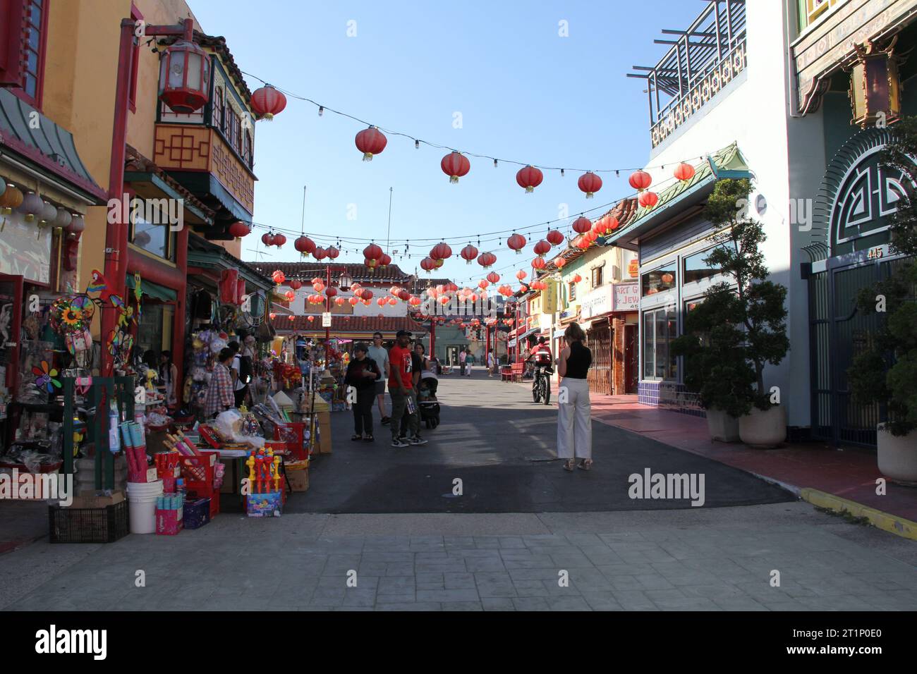 Chinatown Plaza Los Angeles CA Shoppers Pass Outside Market Display Stock Photo
