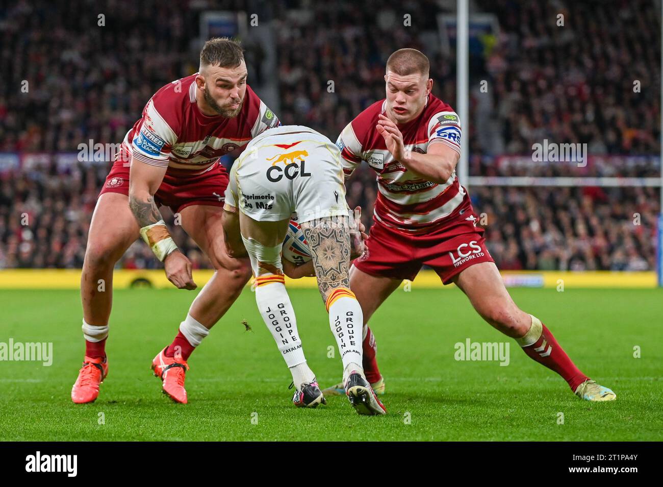 Sam Tomkins #29 of Catalans Dragons is tackled by Morgan Smithies #13 of Wigan Warriors during the Betfred Super League Grand Final match Wigan Warriors vs Catalans Dragons at Old Trafford, Manchester, United Kingdom, 14th October 2023 (Photo by Craig Cresswell/News Images) in, on 10/14/2023. (Photo by Craig Cresswell/News Images/Sipa USA) Credit: Sipa USA/Alamy Live News Stock Photo