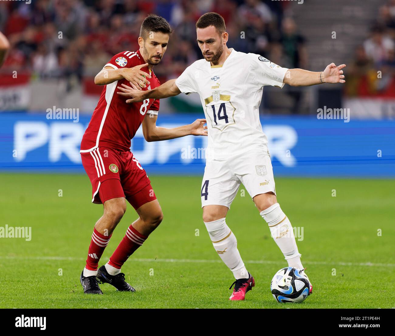 Budapest, Hungary. 14st October, 2023. Adam Nagy of Hungary challenges Andrija Zivkovic of Serbia during the UEFA EURO 2024 European qualifier match between Hungary and Serbia at Puskas Arena on October 14, 2023 in Budapest, Hungary. Credit: Laszlo Szirtesi/Alamy Live News Stock Photo