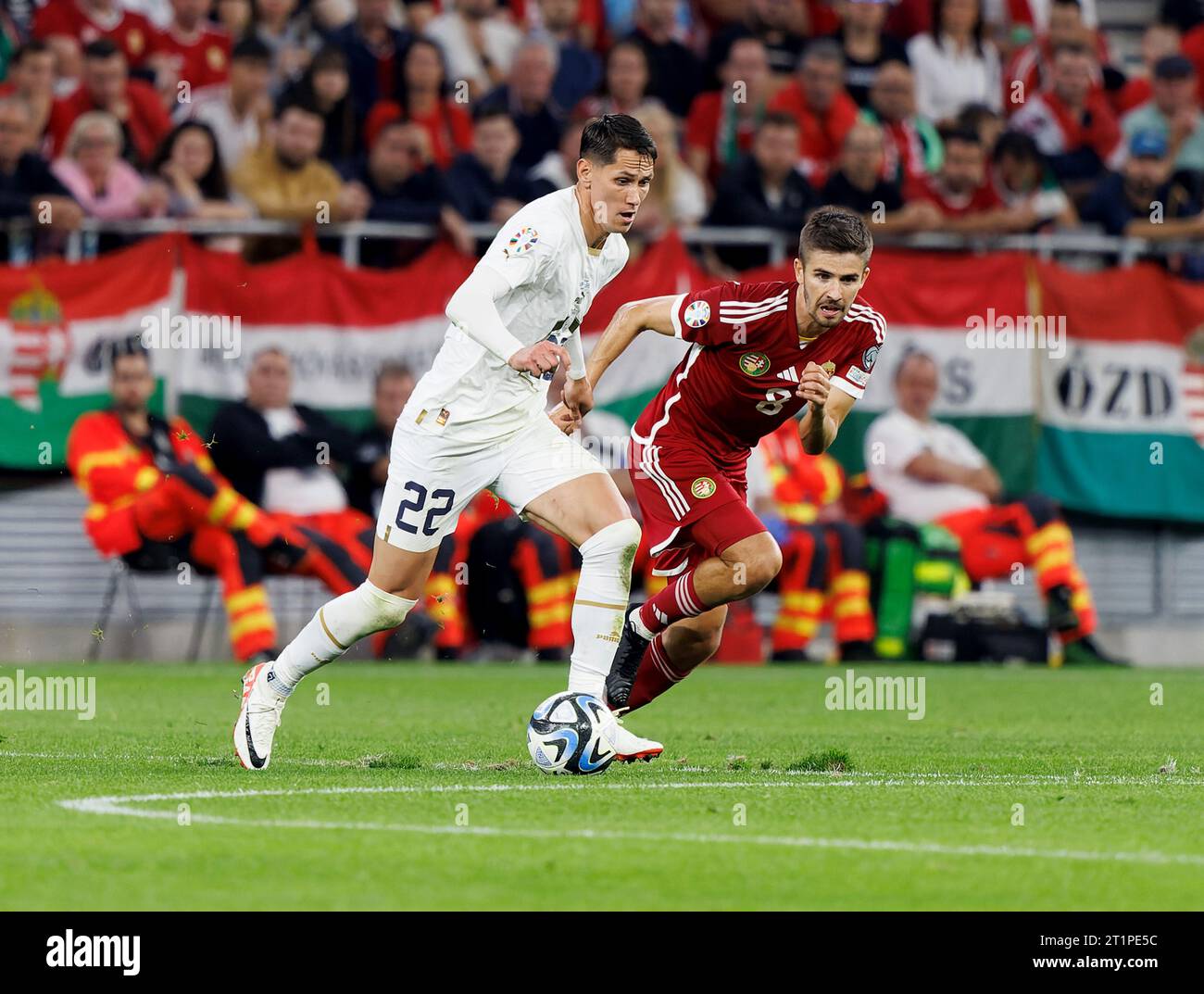 Budapest, Hungary. 14st October, 2023. Sasa Lukic of Serbia competes for the ball with Adam Nagy of Hungary during the UEFA EURO 2024 European qualifier match between Hungary and Serbia at Puskas Arena on October 14, 2023 in Budapest, Hungary. Credit: Laszlo Szirtesi/Alamy Live News Stock Photo