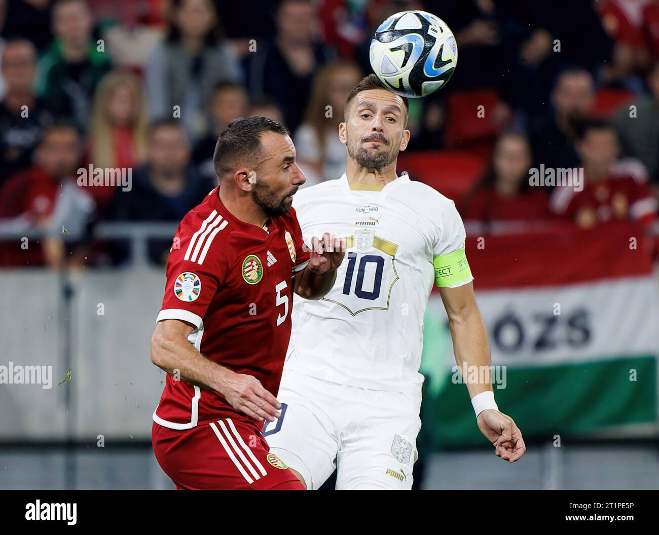 Budapest, Hungary. 14st October, 2023. Attila Fiola of Hungary fights for the possession with Dusan Tadic of Serbia during the UEFA EURO 2024 European qualifier match between Hungary and Serbia at Puskas Arena on October 14, 2023 in Budapest, Hungary. Credit: Laszlo Szirtesi/Alamy Live News Stock Photo