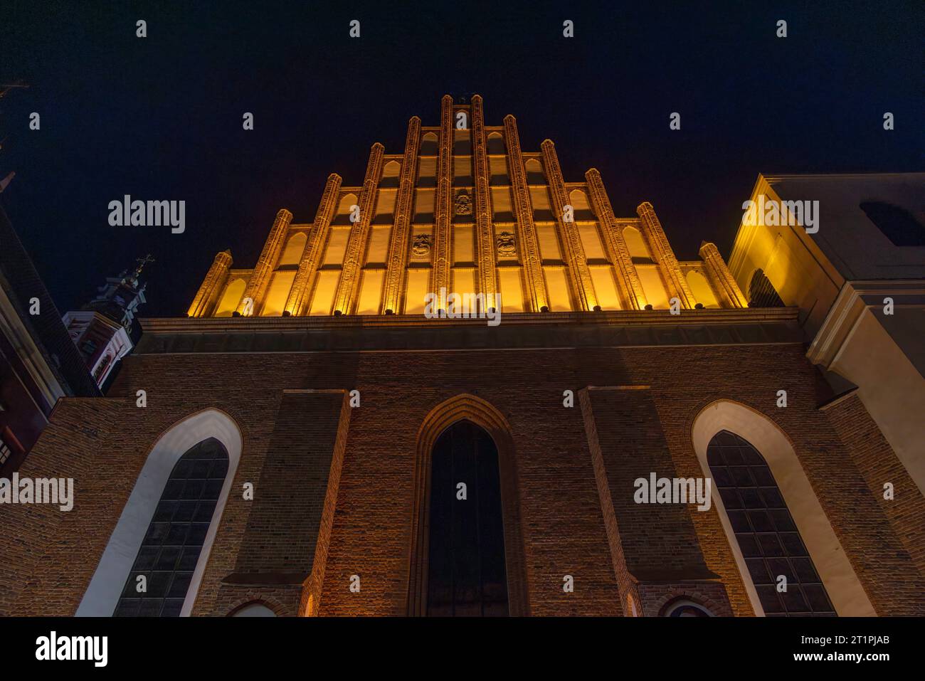 exterior facade of Archcathedral Basilica of St. John the Baptist at night, old town, Warsaw, Poland Stock Photo