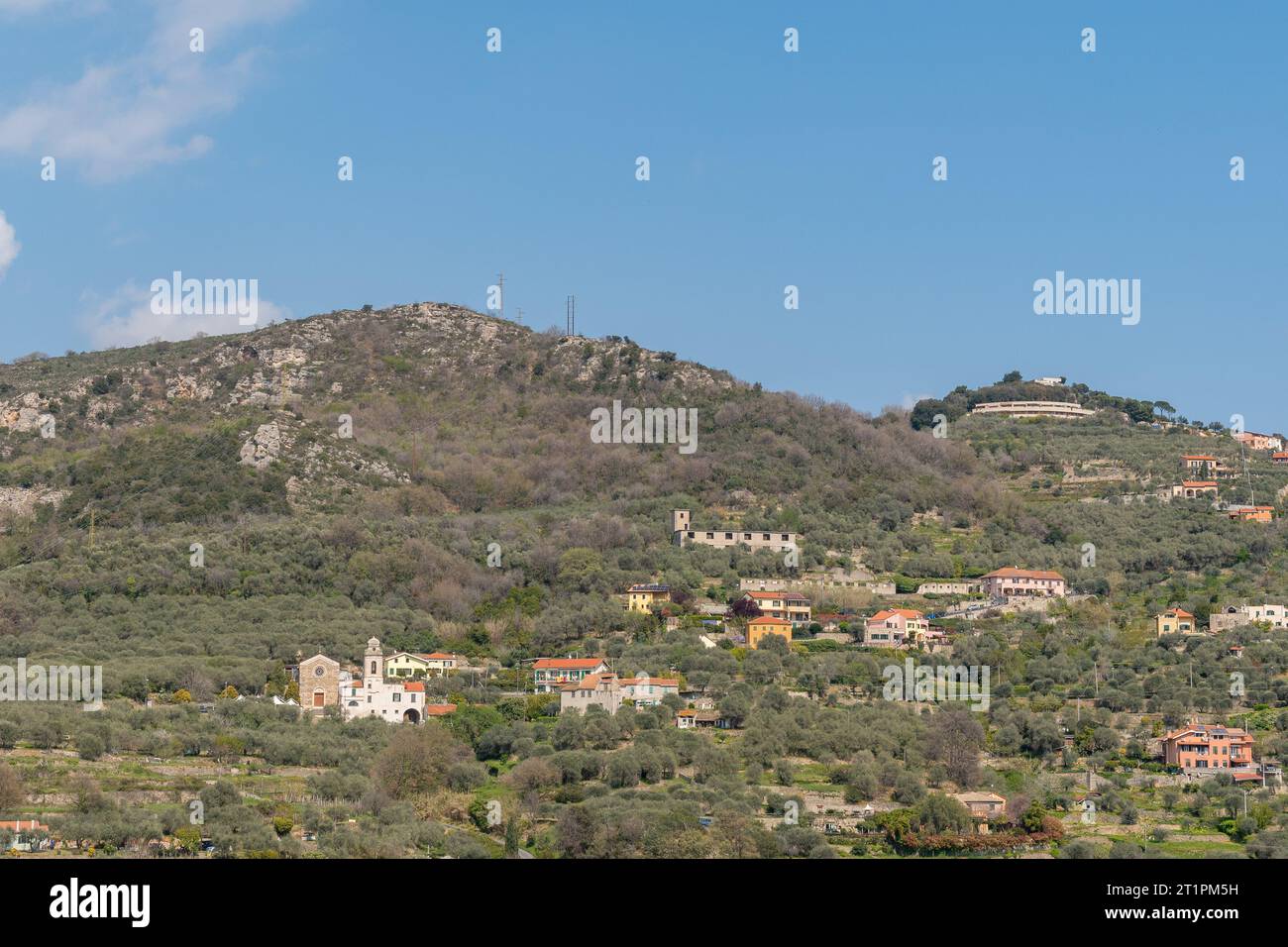 View of the hamlet of Monticello with the church of San Dalmazio Martire on the hill overlooking the Valle dell'Aquila, Finale Ligure, Savona, Liguria Stock Photo