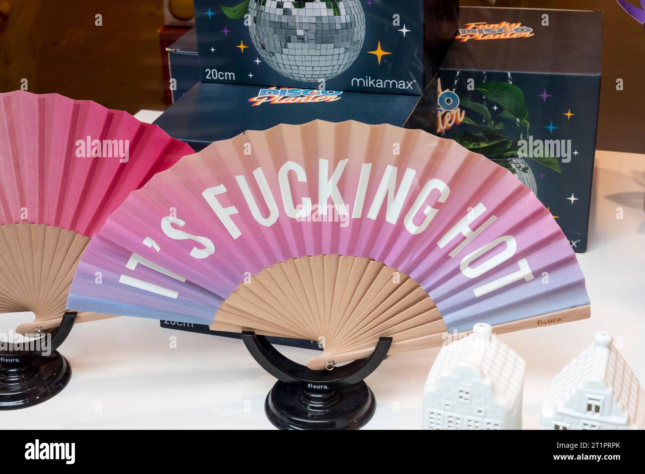 Message on a fan for sale in an Amsterdam shop window. Stock Photo