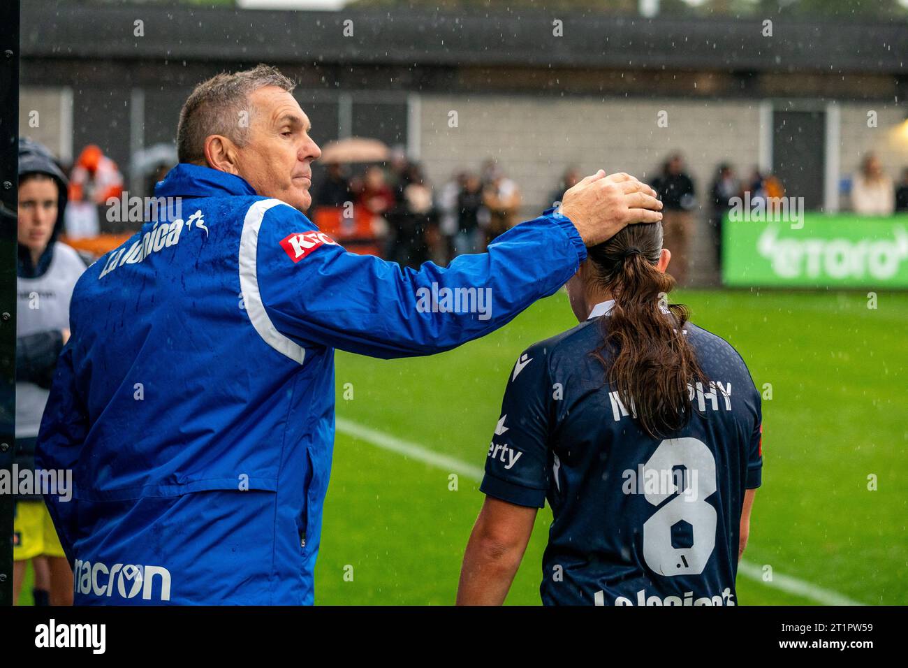Bundoora, Australia. 15 October, 2023. Melbourne Victory Coach Jeff Hopkins consoling Melbourne Victory Midfielder Alana Murphy (#8) after making the late substitution. Credit: James Forrester/Alamy Live News Stock Photo