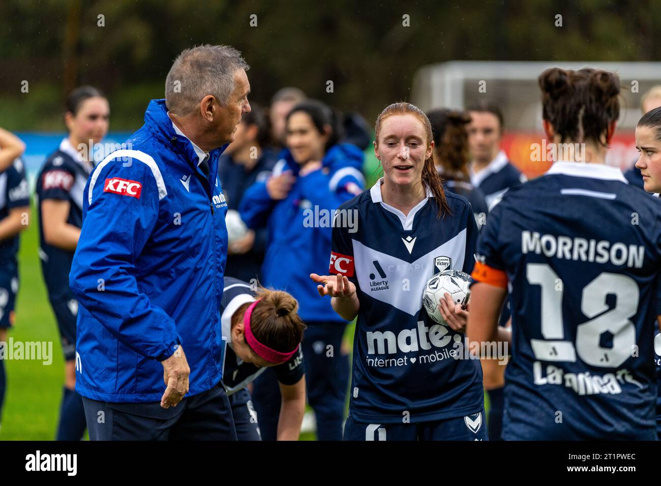Bundoora, Australia. 15 October, 2023. Melbourne Victory Coach Jeff Hopkins with Melbourne Victory Midfielder Beattie Goad (#6) talking over the game just after the final whistle. Credit: James Forrester/Alamy Live News Stock Photo