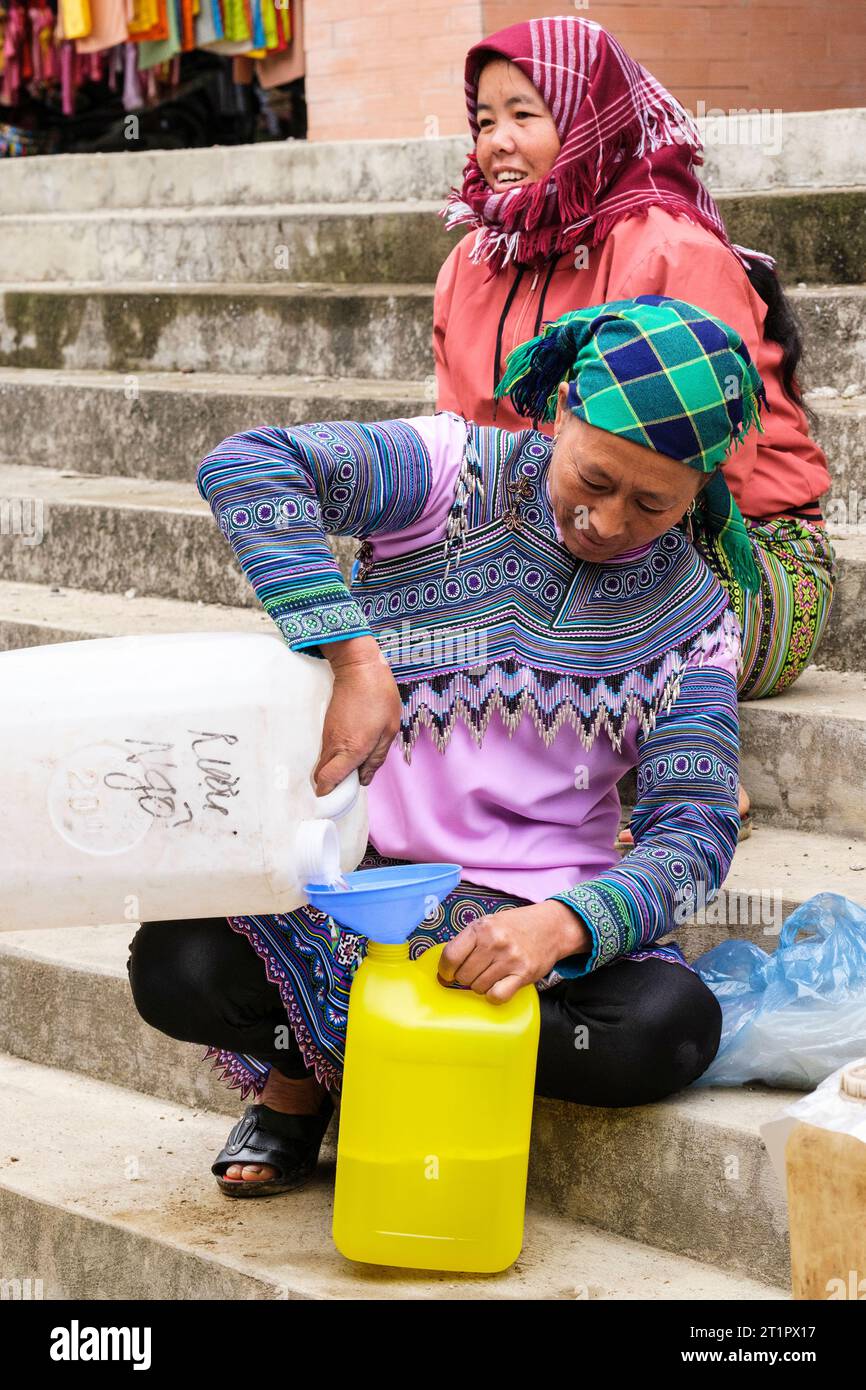 Can Cau Market Scene, Vietnam. Hmong Woman Selling Home-made Alcohol ...